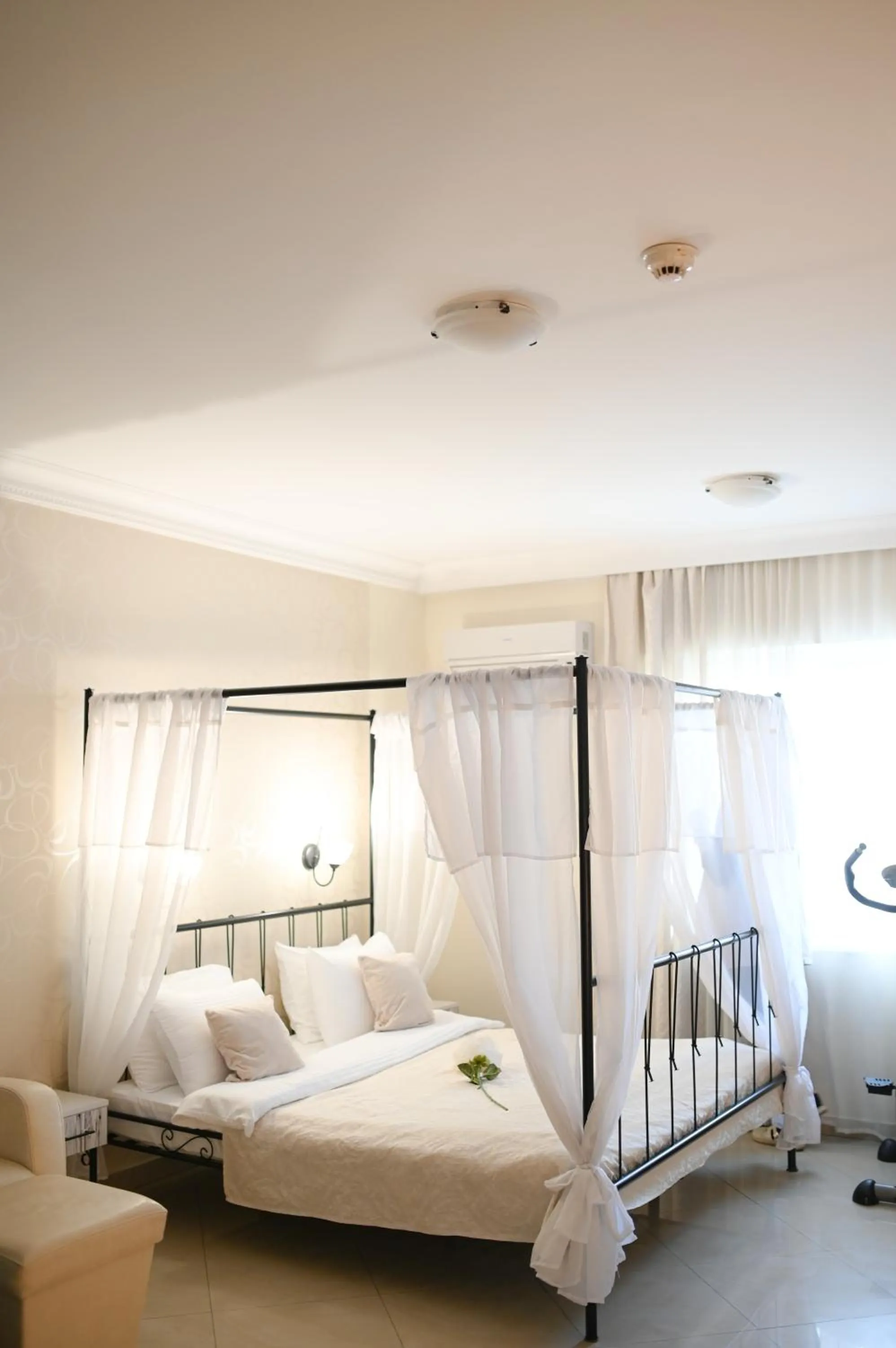 Bed in Garni Hotel Dash