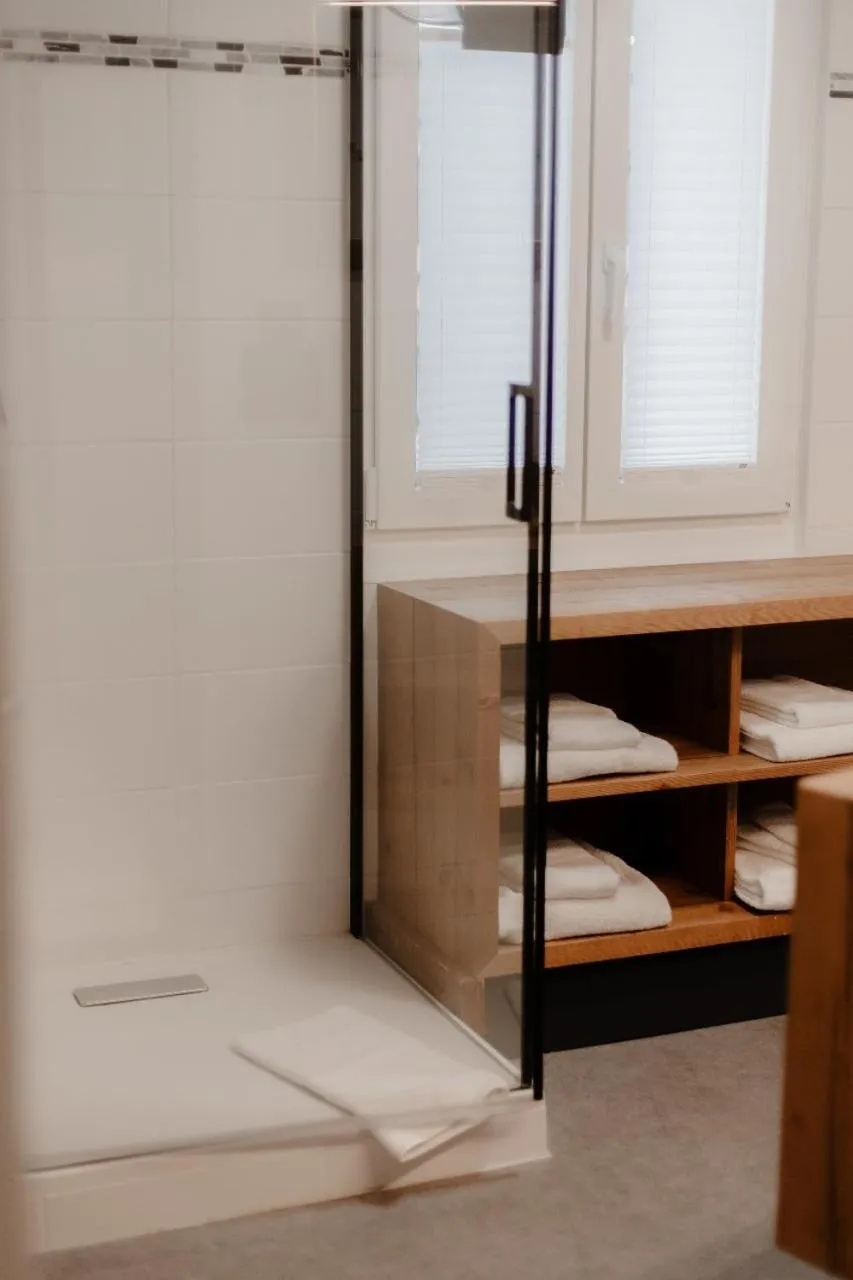 Bathroom, Bed in Lifestyle & Spa Hotel Grächerhof