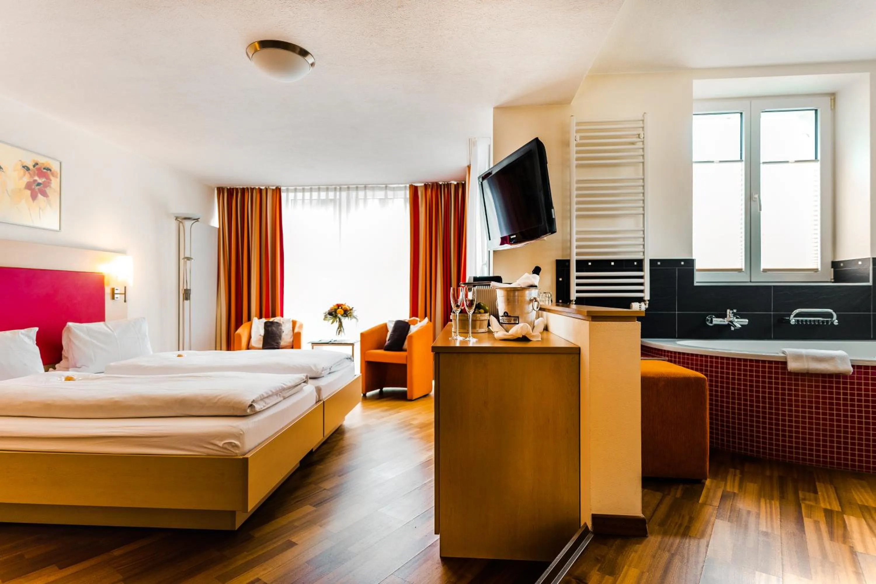 Communal lounge/ TV room, Bed in Lifestyle & Spa Hotel Grächerhof