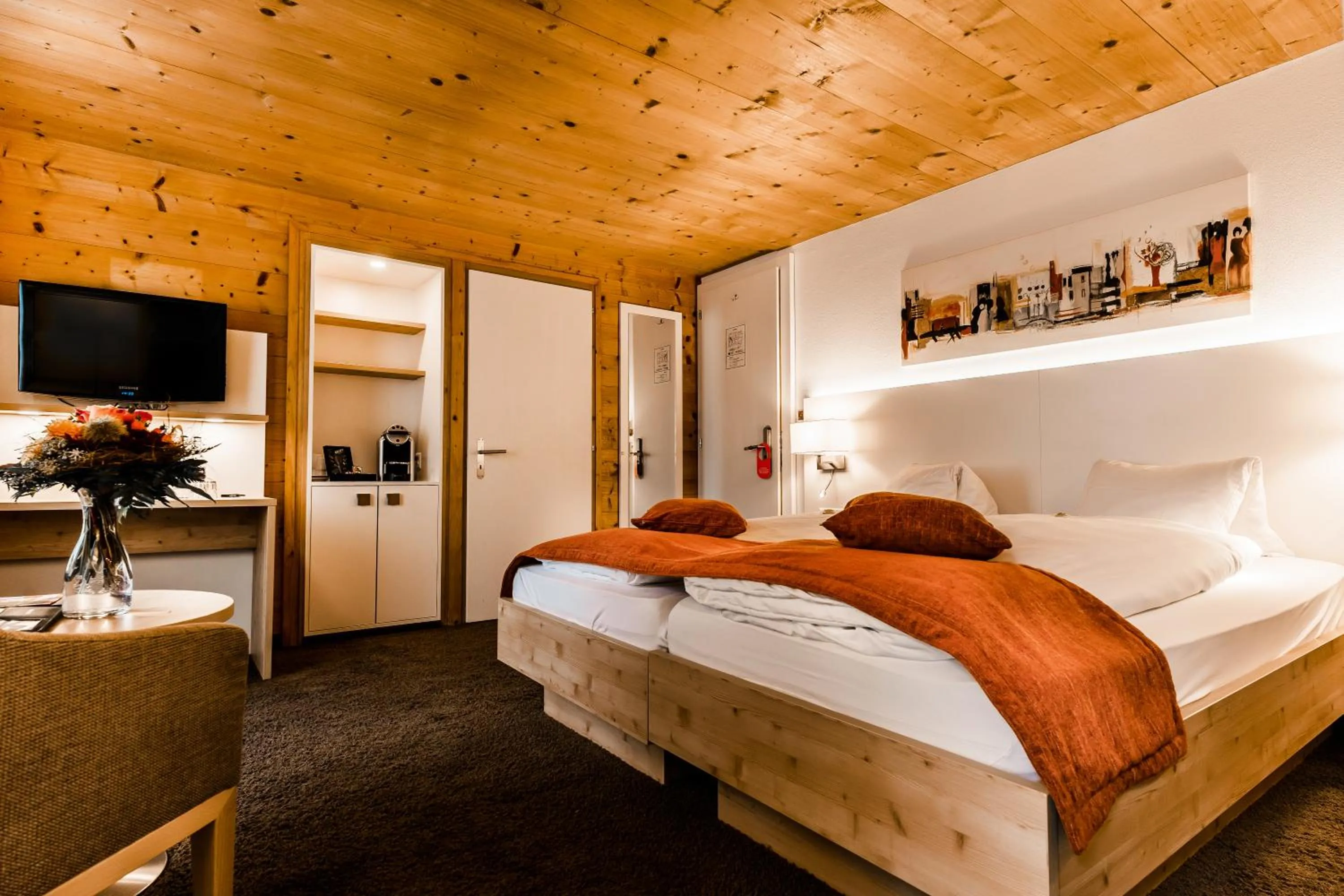 Communal lounge/ TV room, Bed in Lifestyle & Spa Hotel Grächerhof