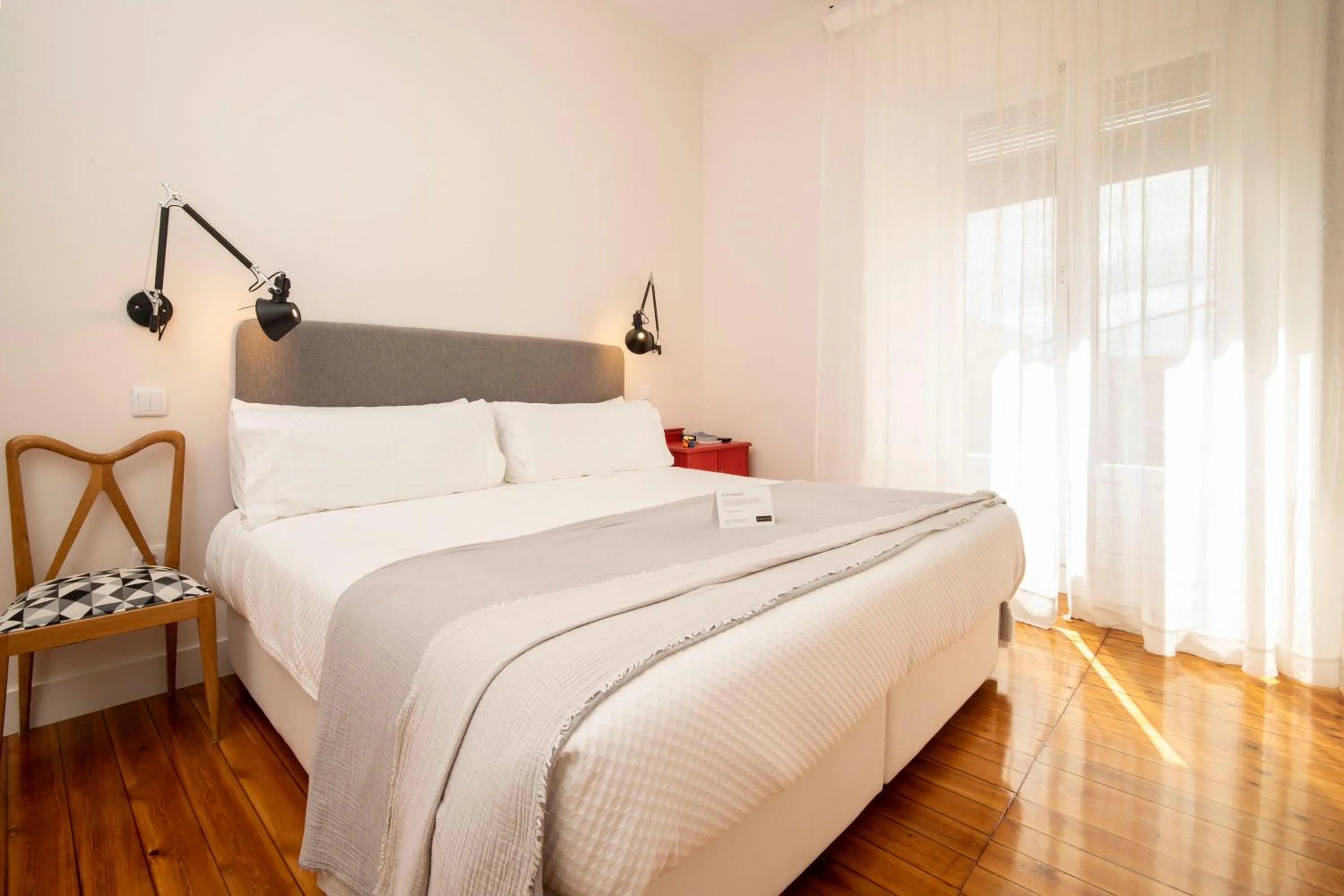 Bed in SANMARTINA HOTEL