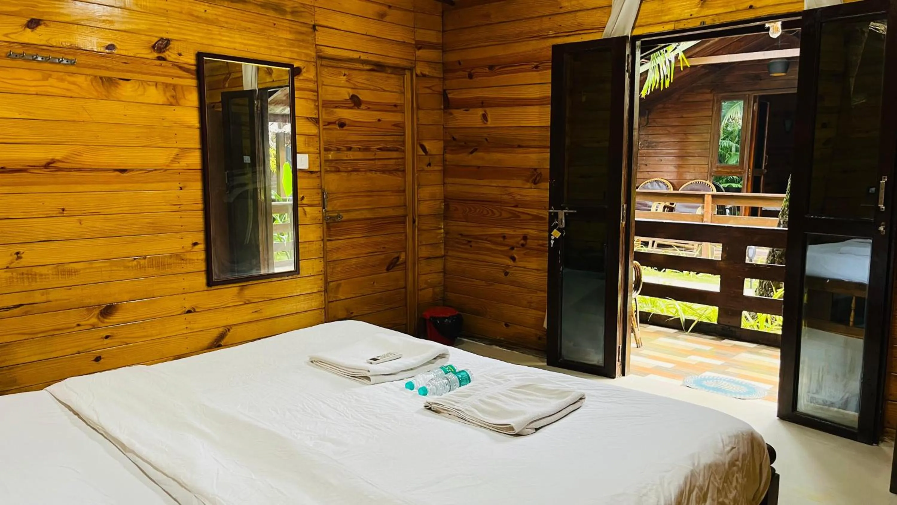Bed in Palolem Luxuries Beach Cottages