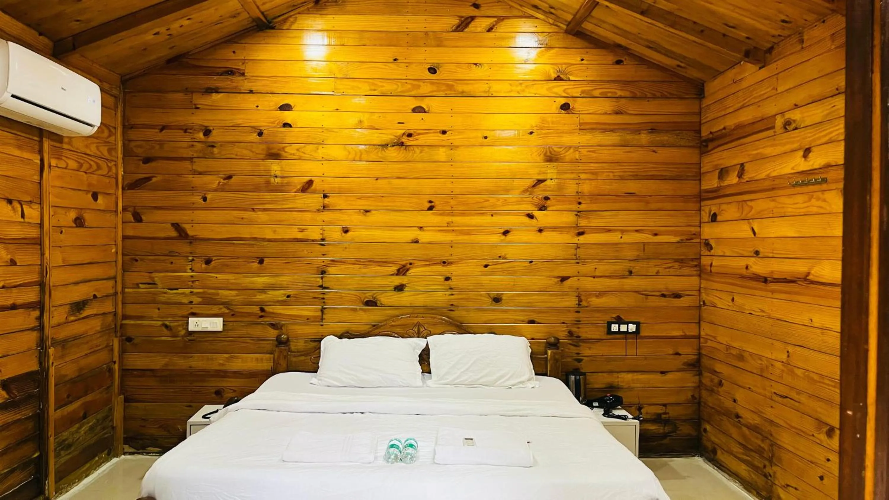 Bed in Palolem Luxuries Beach Cottages