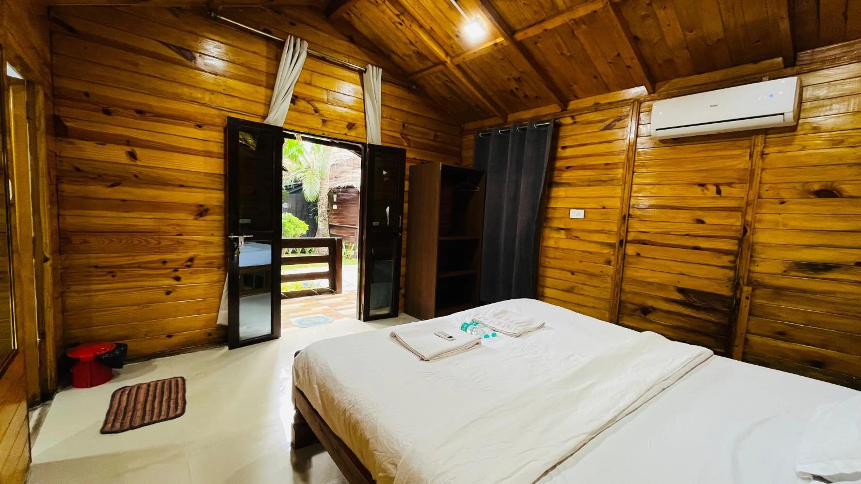 Bed in Palolem Luxuries Beach Cottages