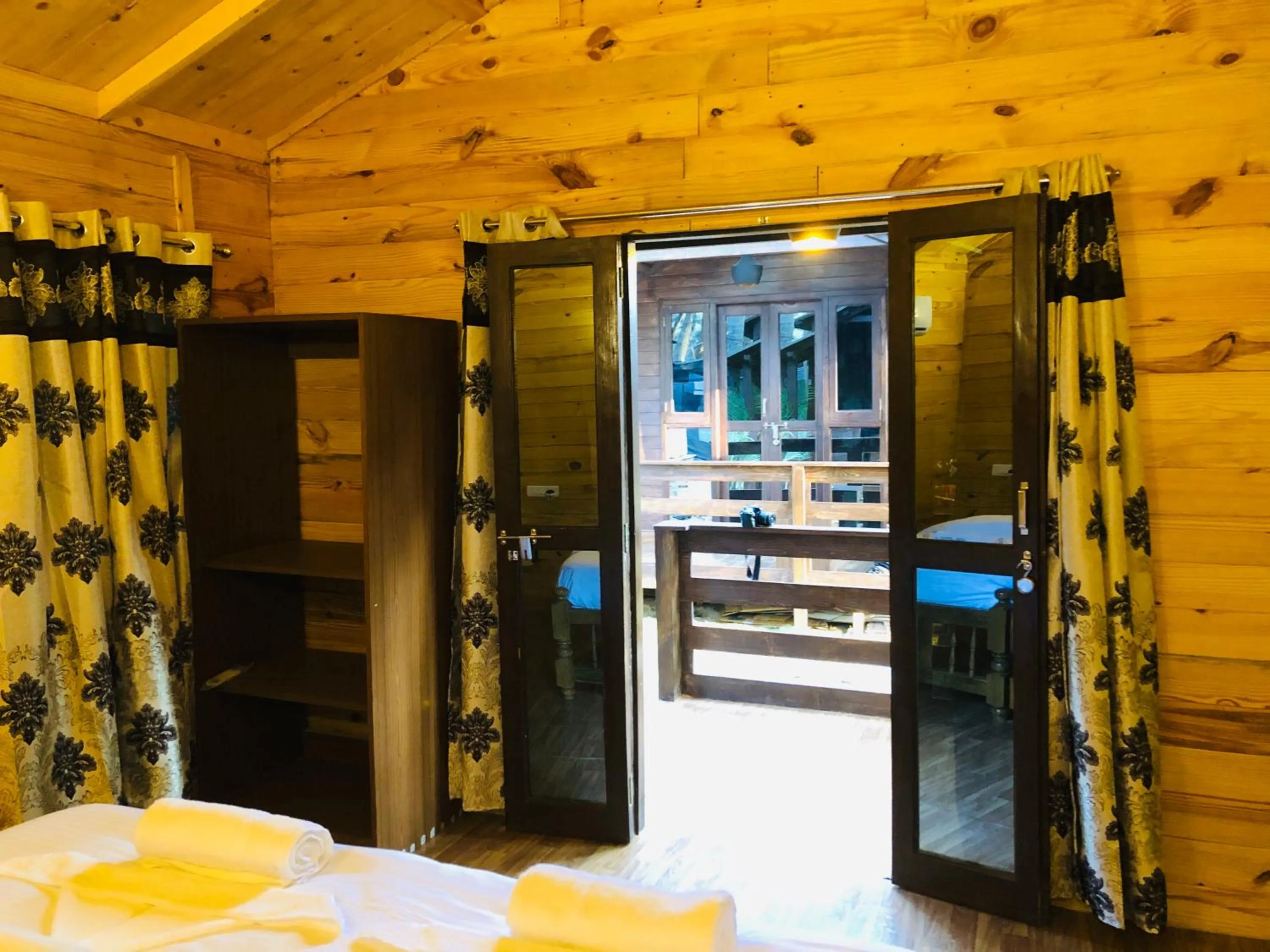 Bed in Palolem Luxuries Beach Cottages