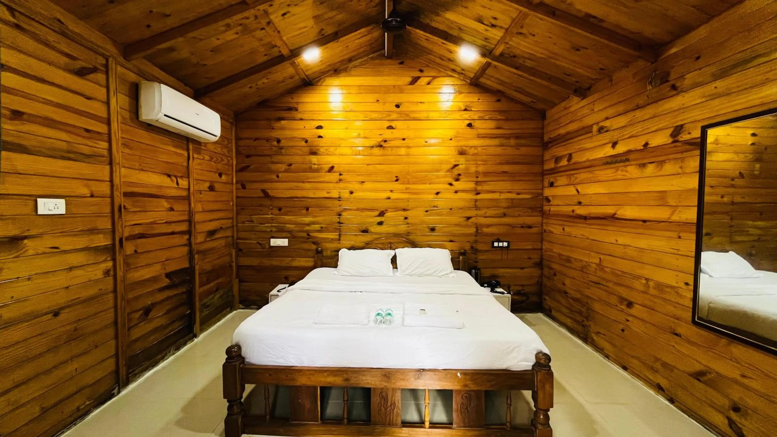 Bed in Palolem Luxuries Beach Cottages