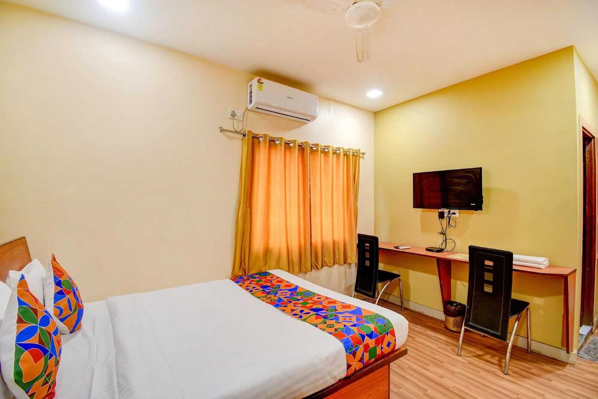 Bed in FabHotel Kamala Inn