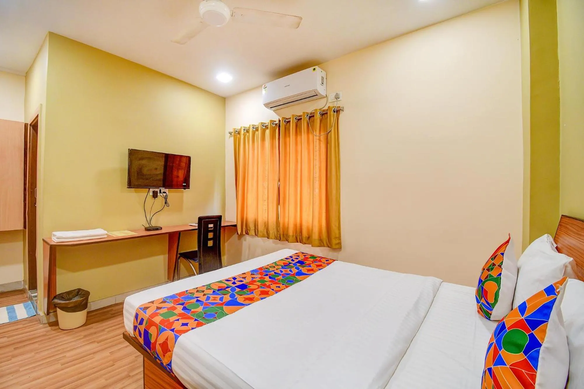 Bed in FabHotel Kamala Inn