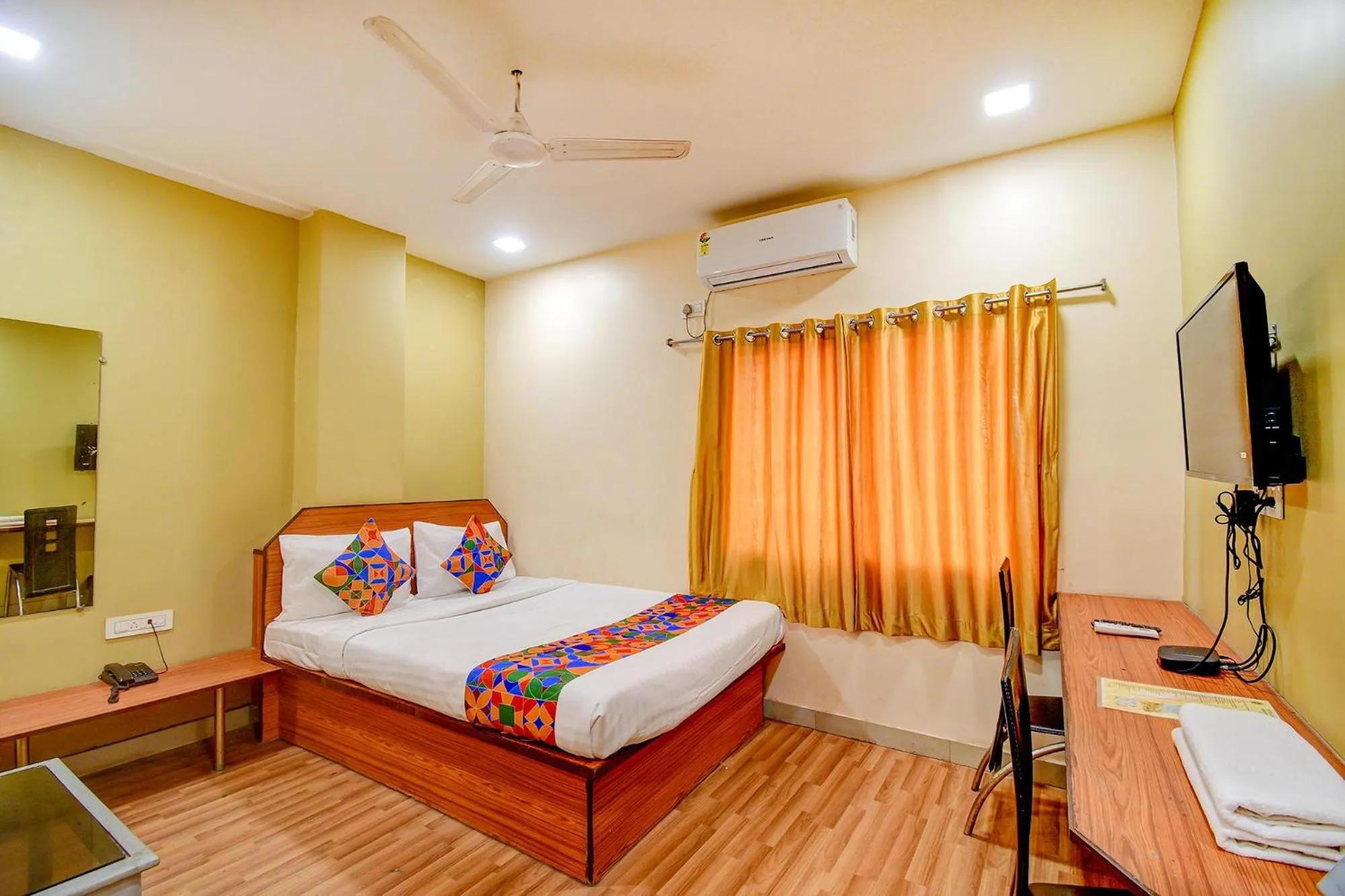 Bed in FabHotel Kamala Inn