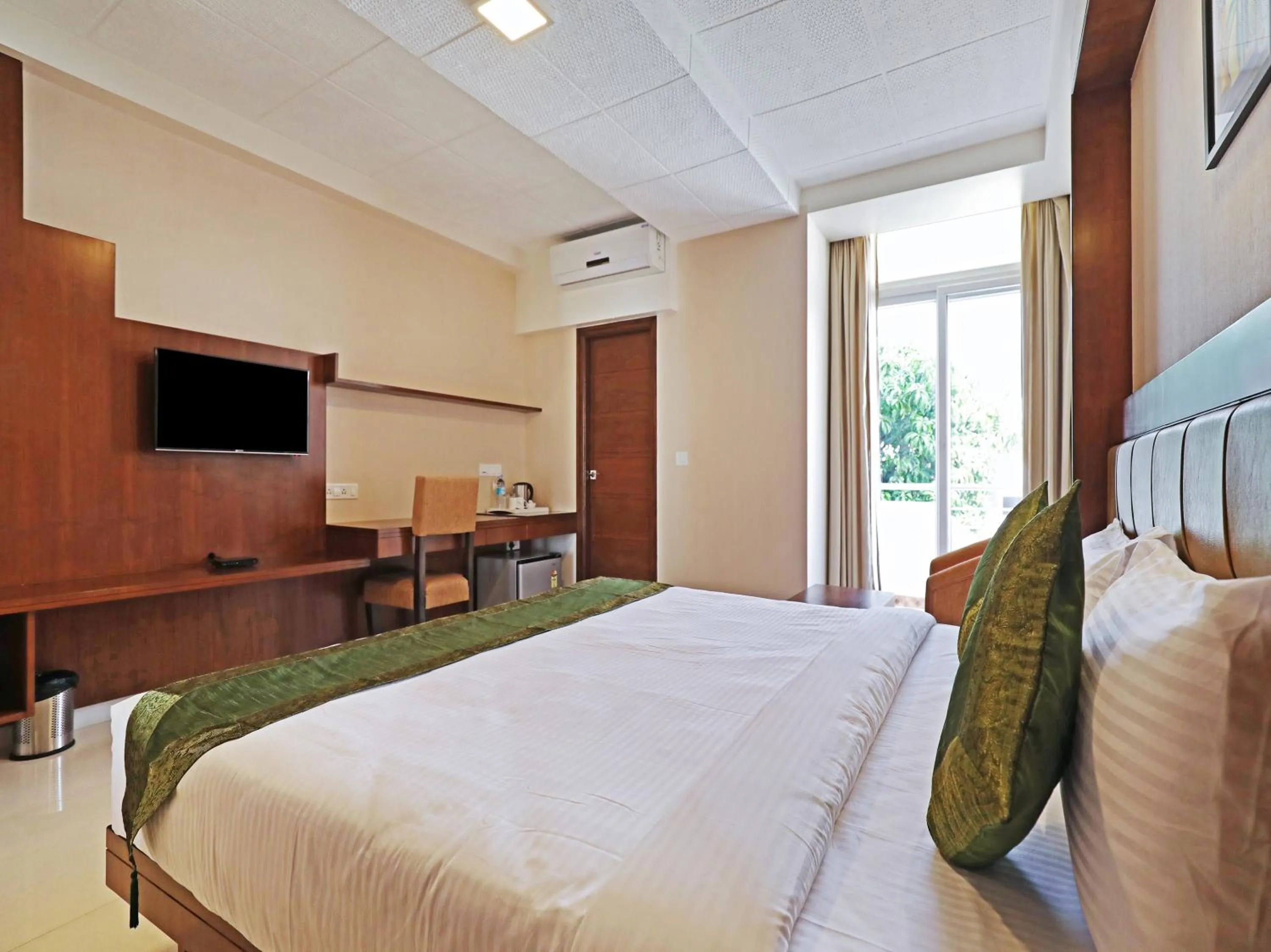 Bed in Treebo Akshaya Bull Temple