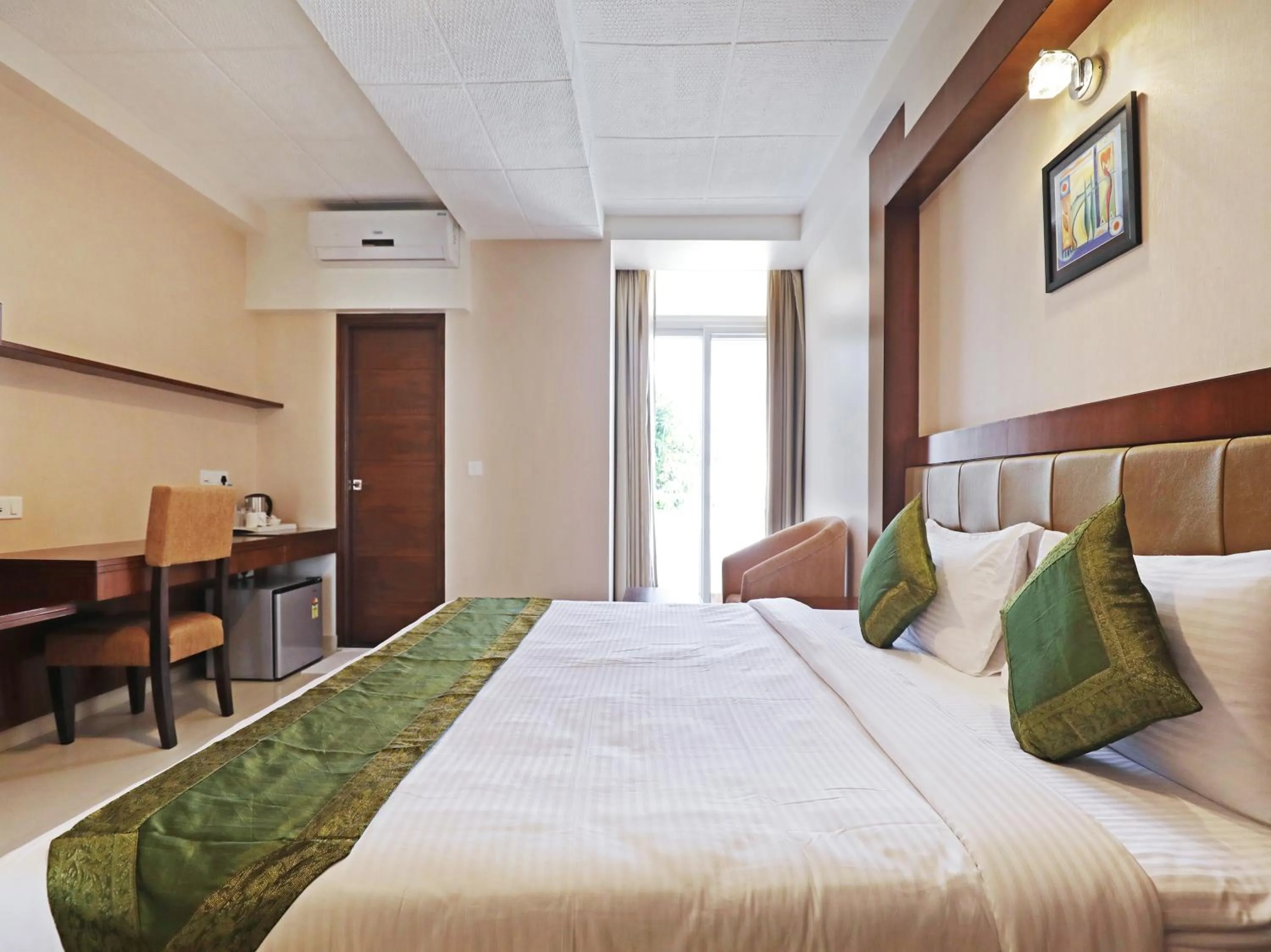 Bed in Treebo Akshaya Bull Temple