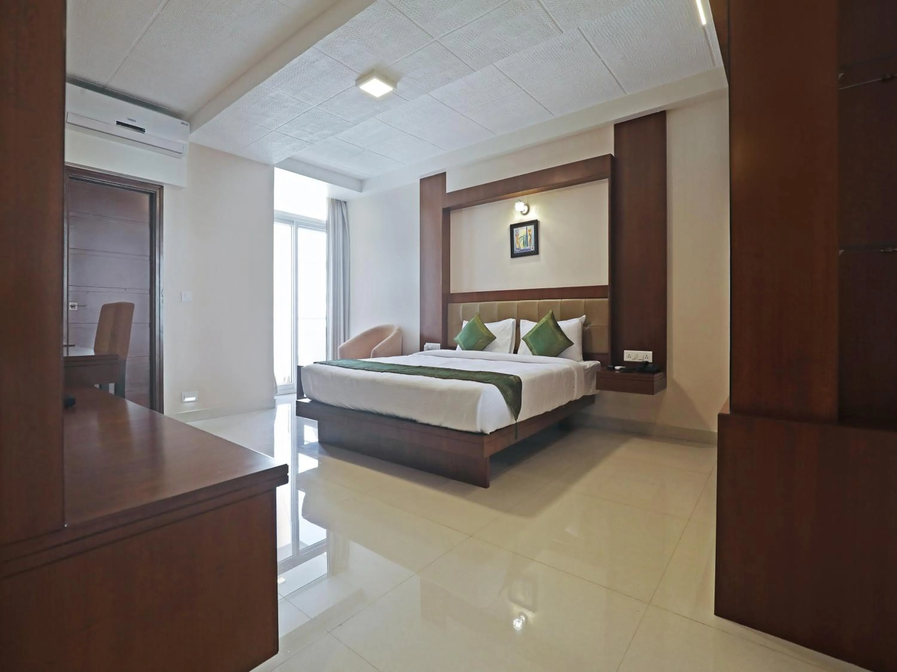 Bed in Treebo Akshaya Bull Temple