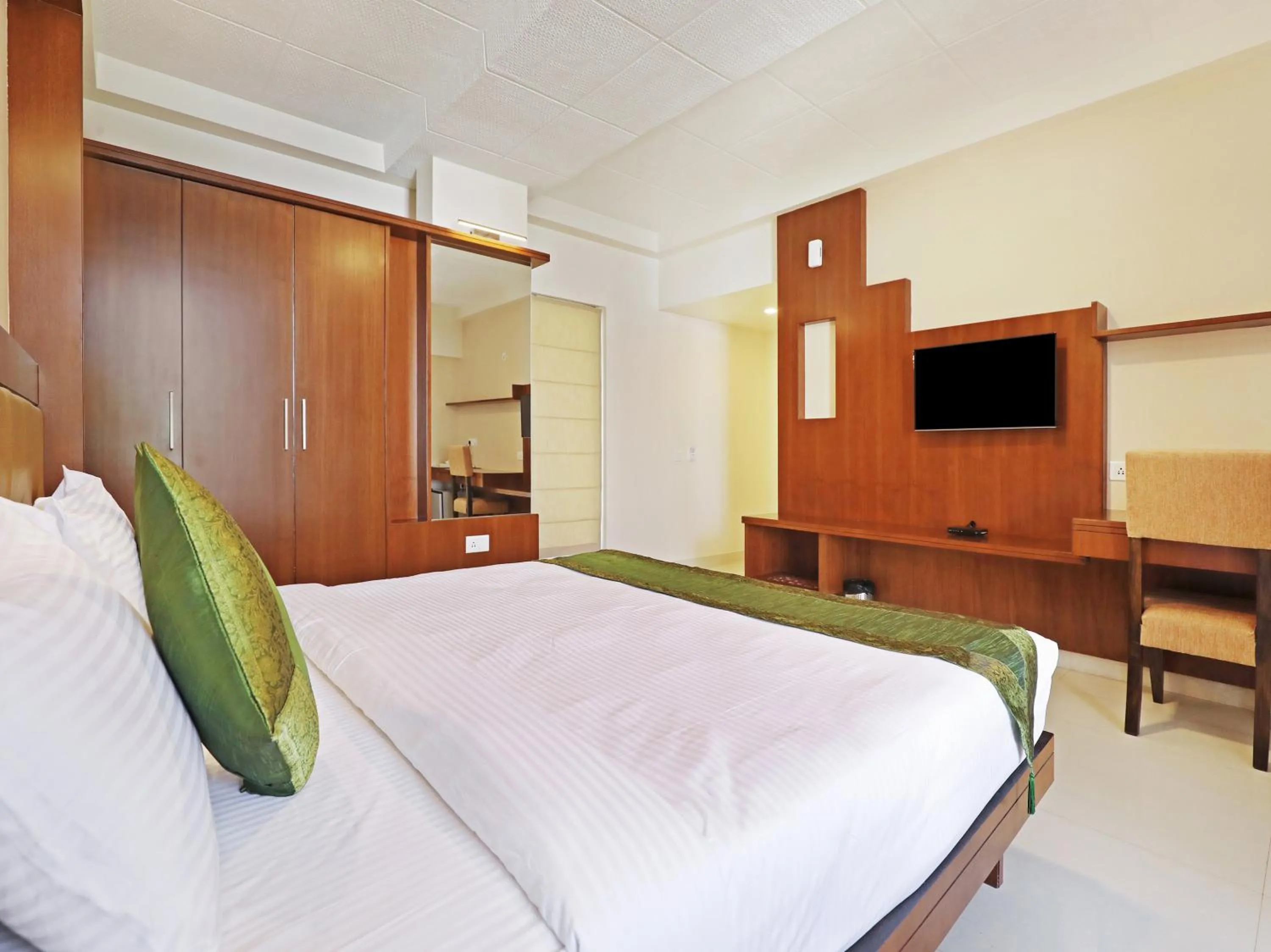 Bed in Treebo Akshaya Bull Temple