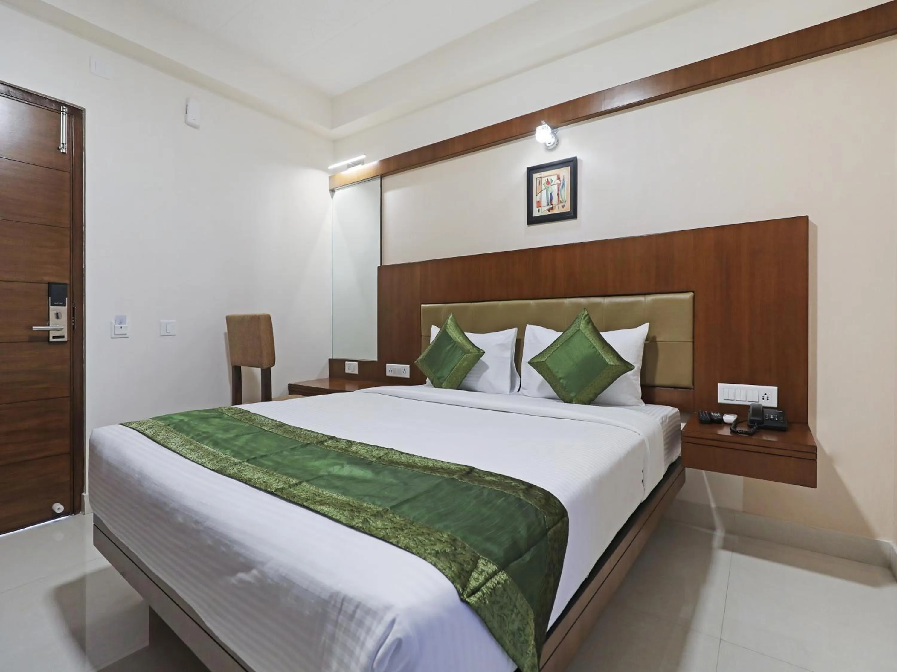 Bed in Treebo Akshaya Bull Temple