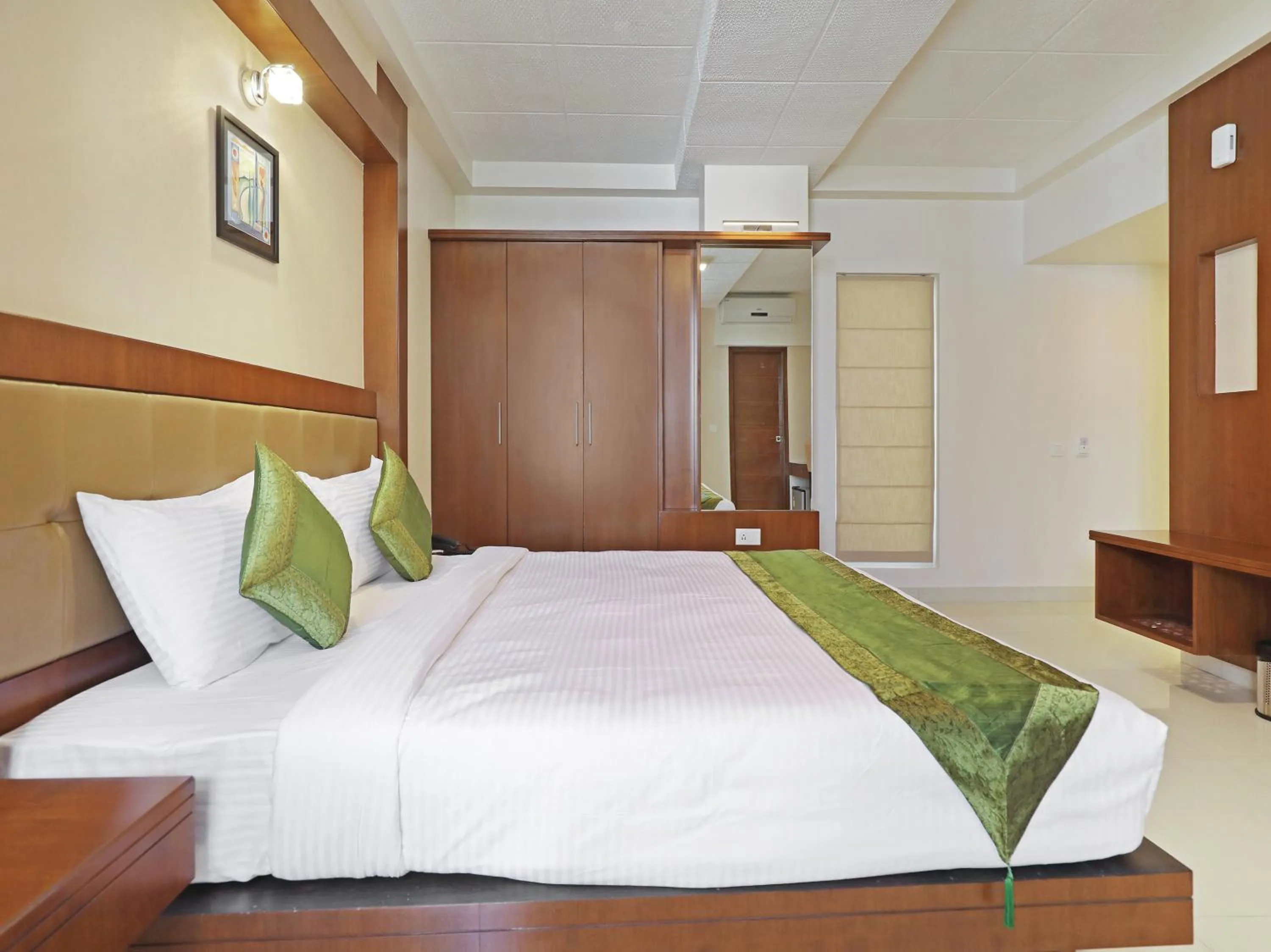 Bed in Treebo Akshaya Bull Temple