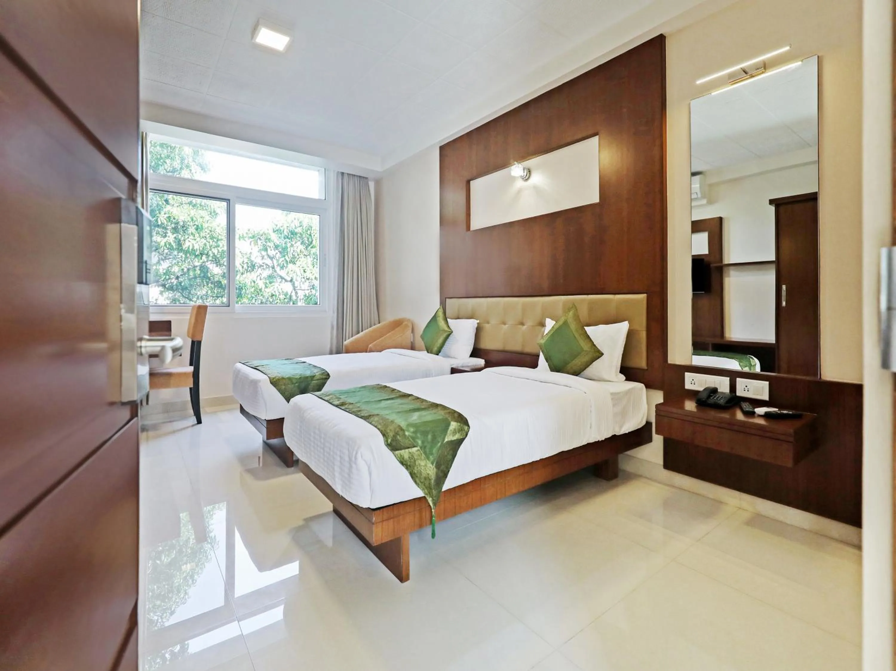 Bed in Treebo Akshaya Bull Temple