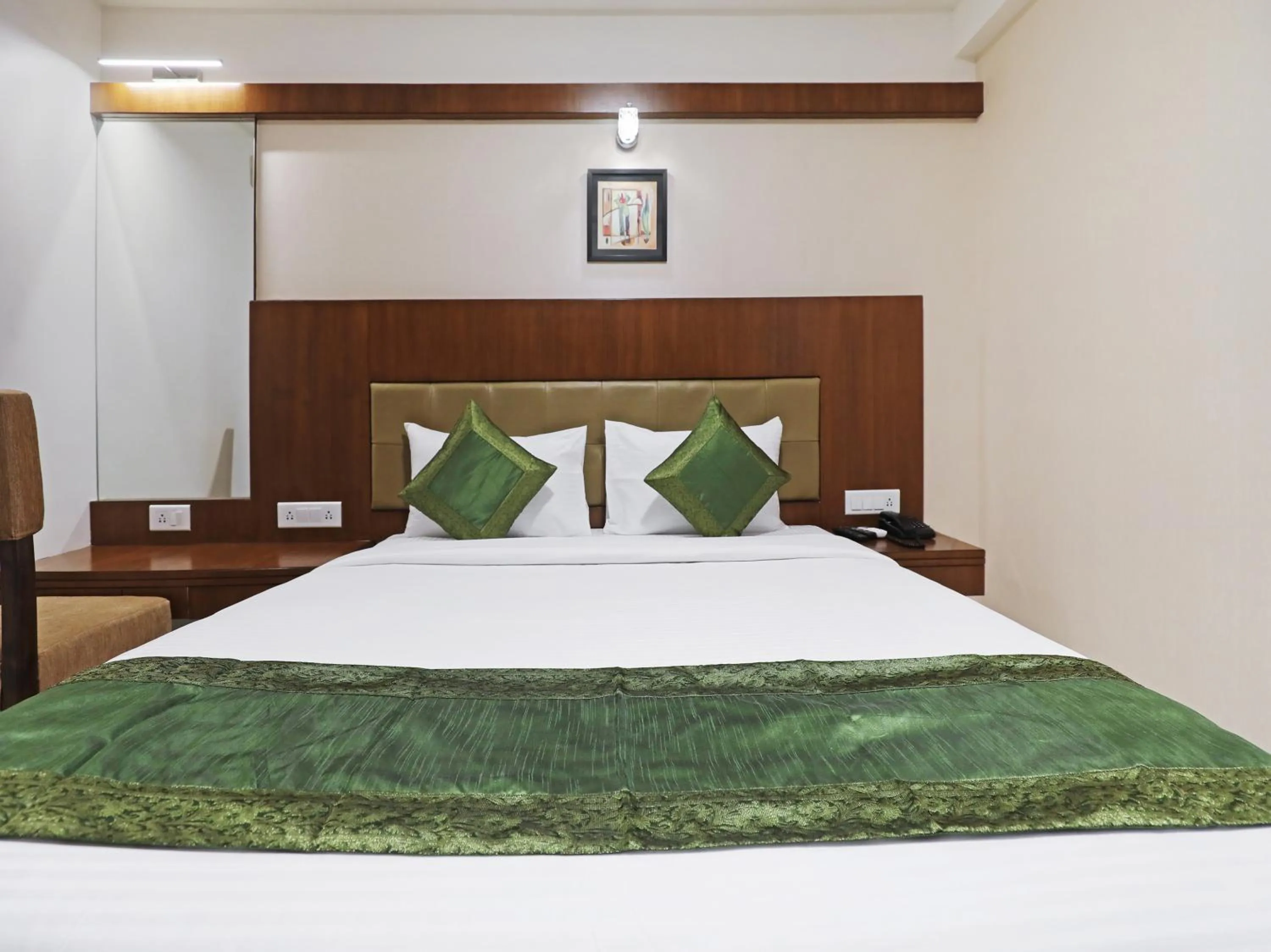 Bed in Treebo Akshaya Bull Temple