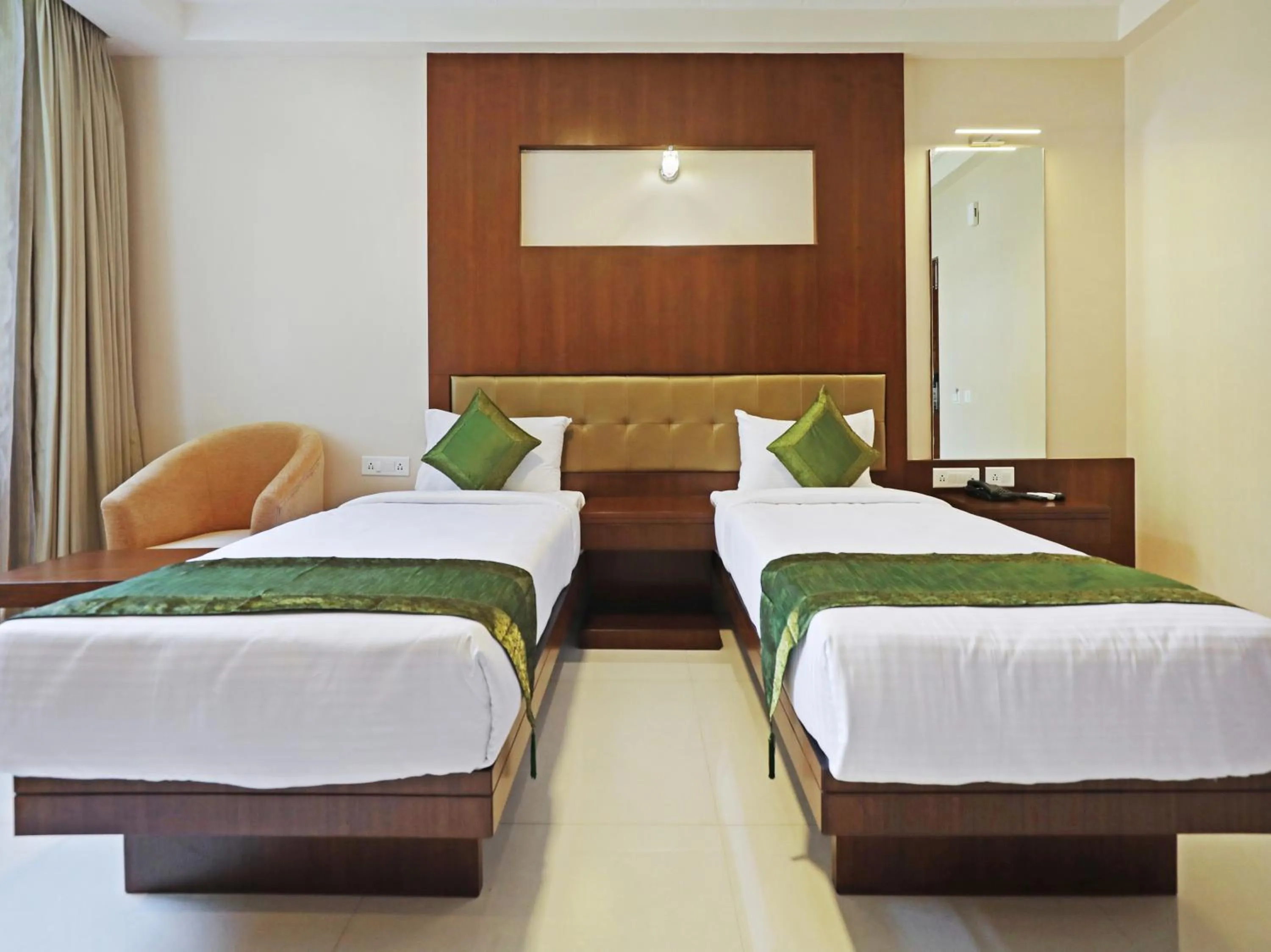 Bed in Treebo Akshaya Bull Temple