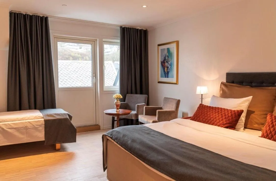 Photo of the whole room, Bed in Grand Hotel Flekkefjord