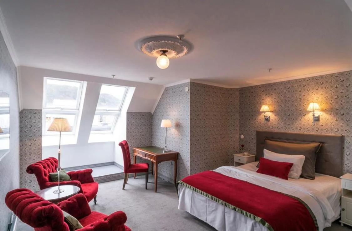 Photo of the whole room, Bed in Grand Hotel Flekkefjord