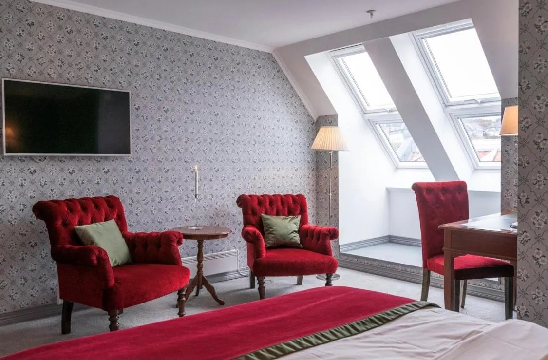 Photo of the whole room, Bed in Grand Hotel Flekkefjord