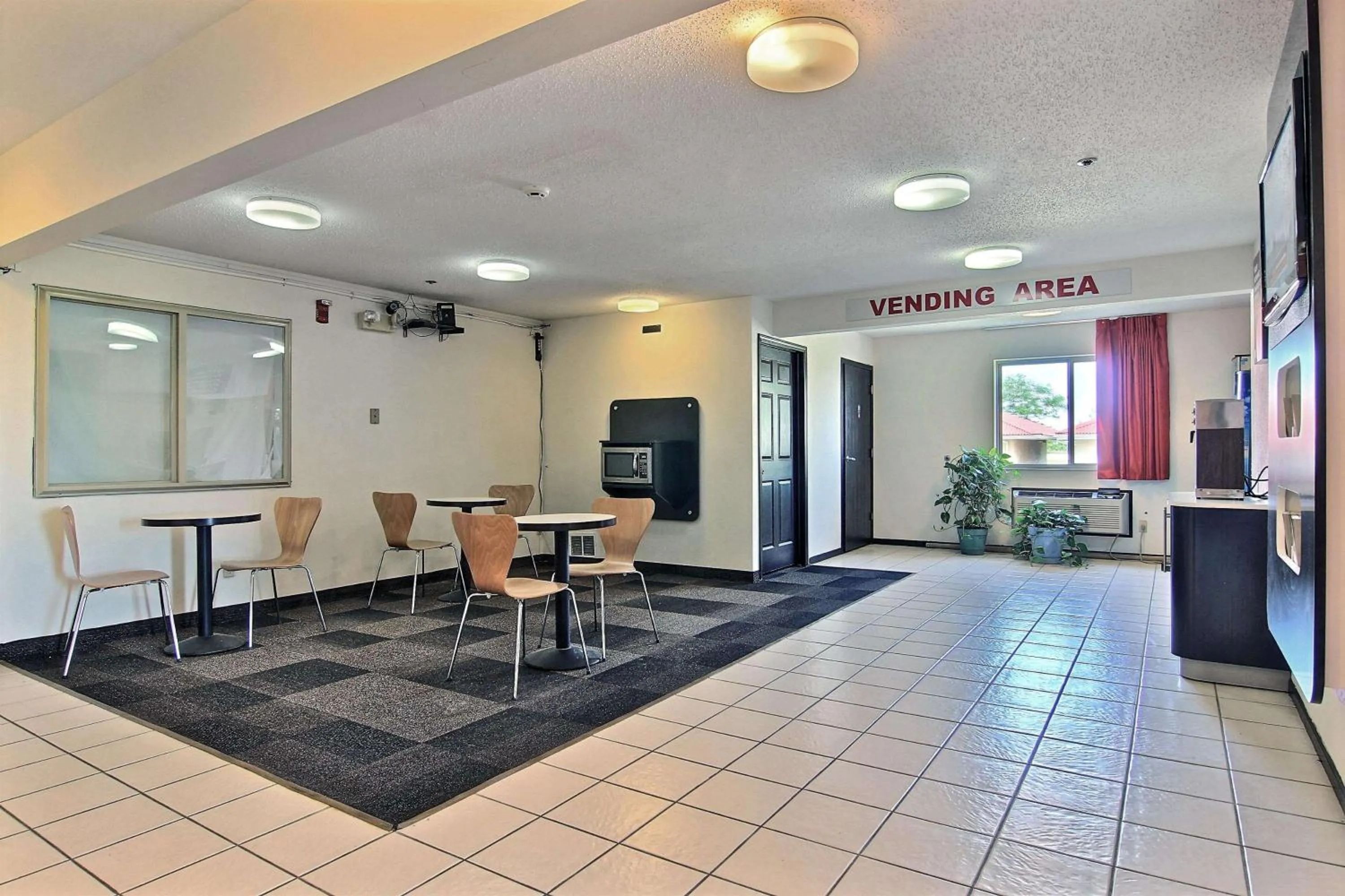 Communal lounge/ TV room in Motel 6-Gilman, IL