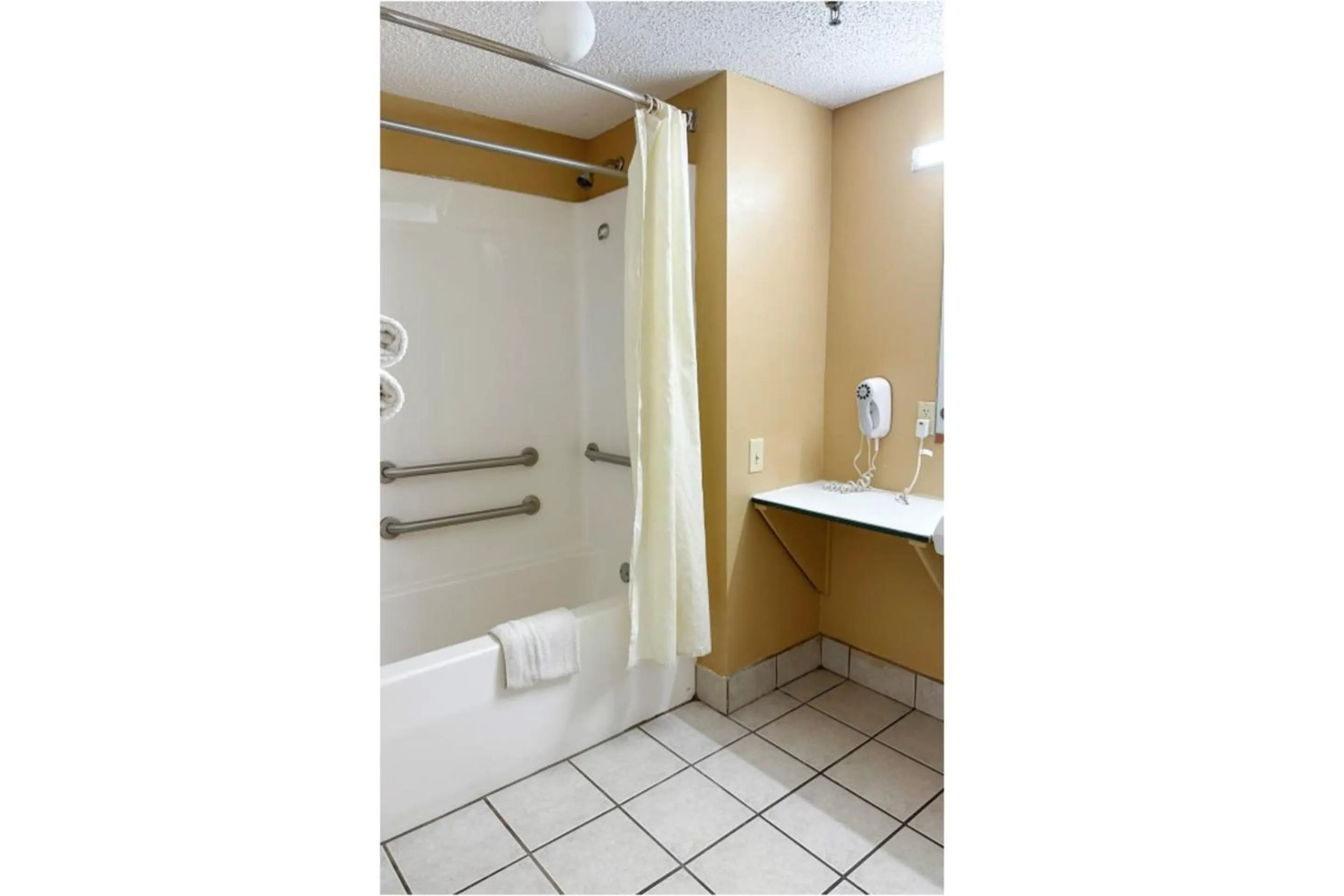 Bathroom in Garden Inn & Suites