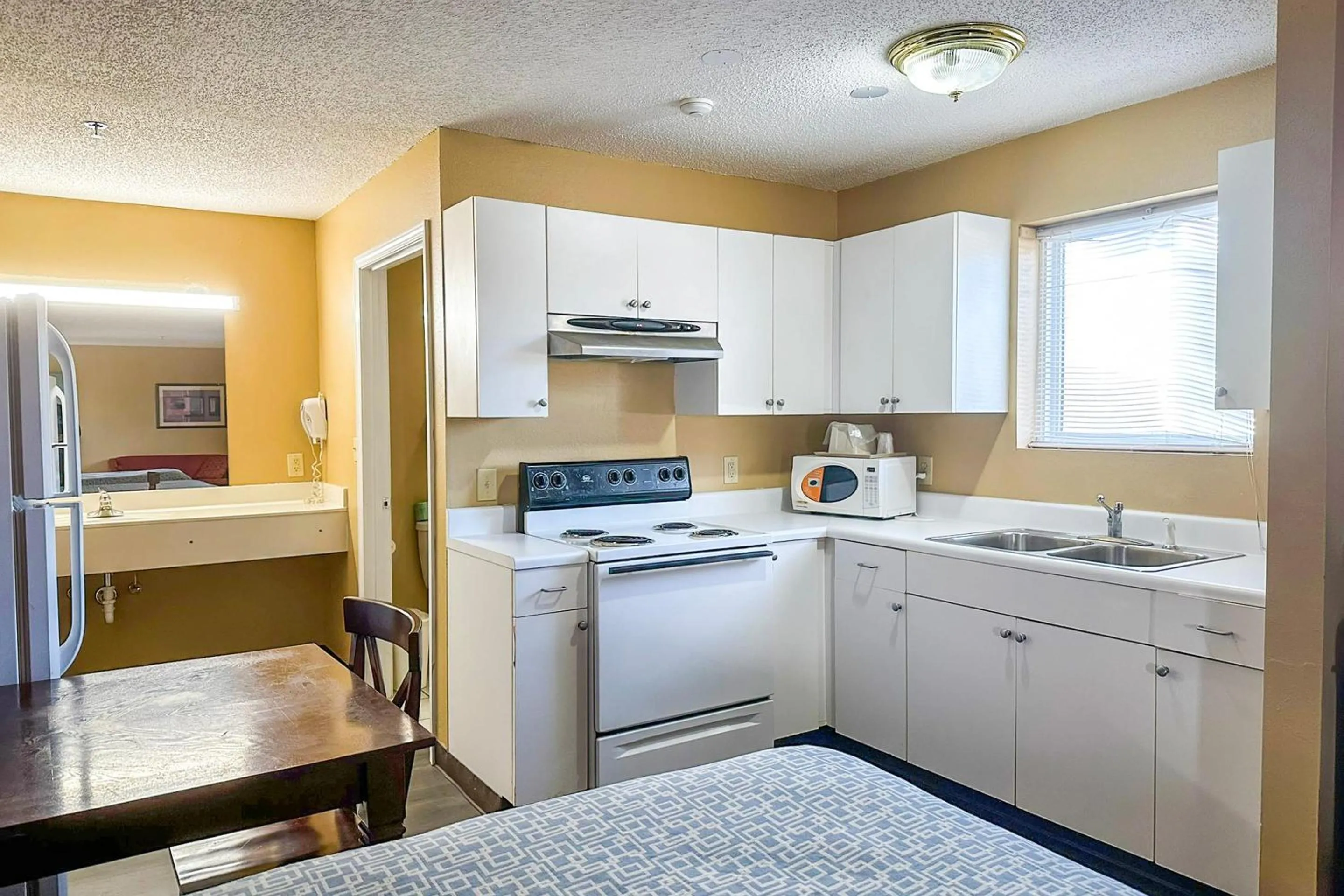 Bedroom in Garden Inn & Suites