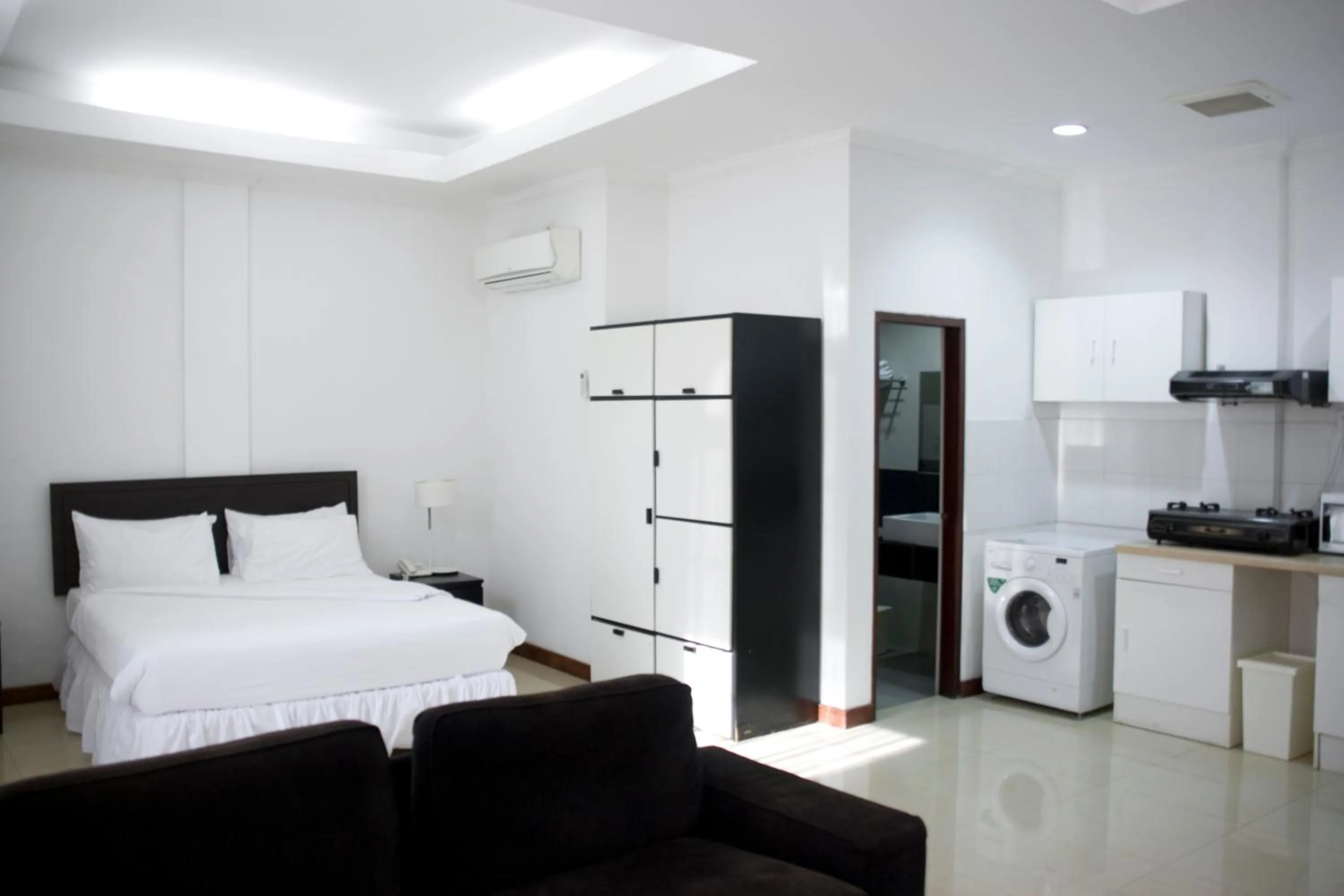 Kitchen or kitchenette, Bed in Hotel The Ramelau