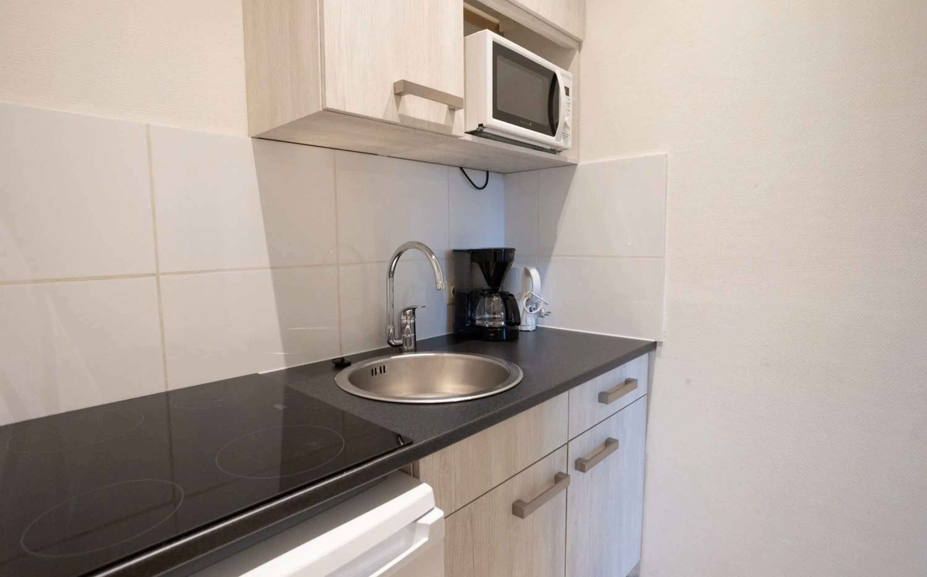 Kitchen or kitchenette in Holiday Park La Sapinière