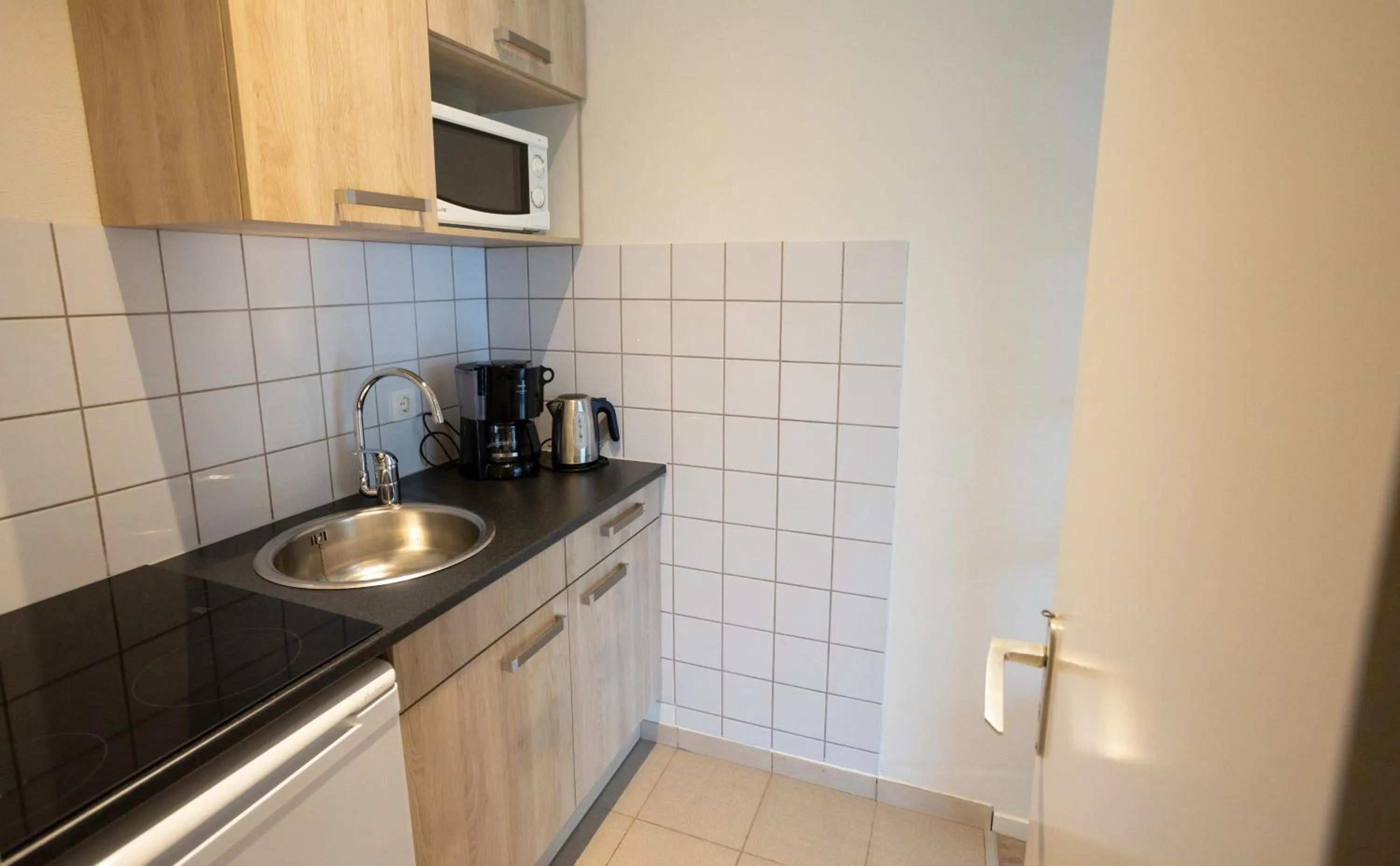 Kitchen or kitchenette in Holiday Park La Sapinière