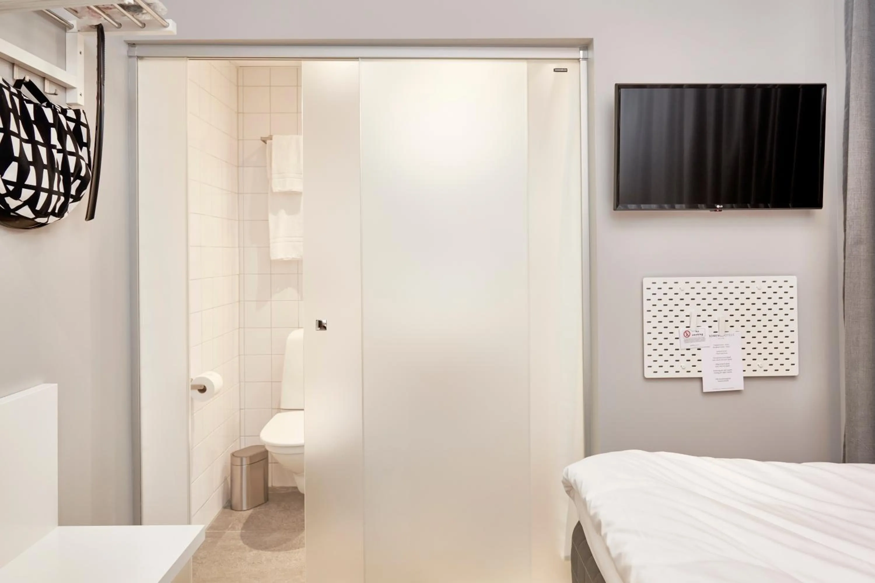 Bathroom, Bed in Moment Hotels
