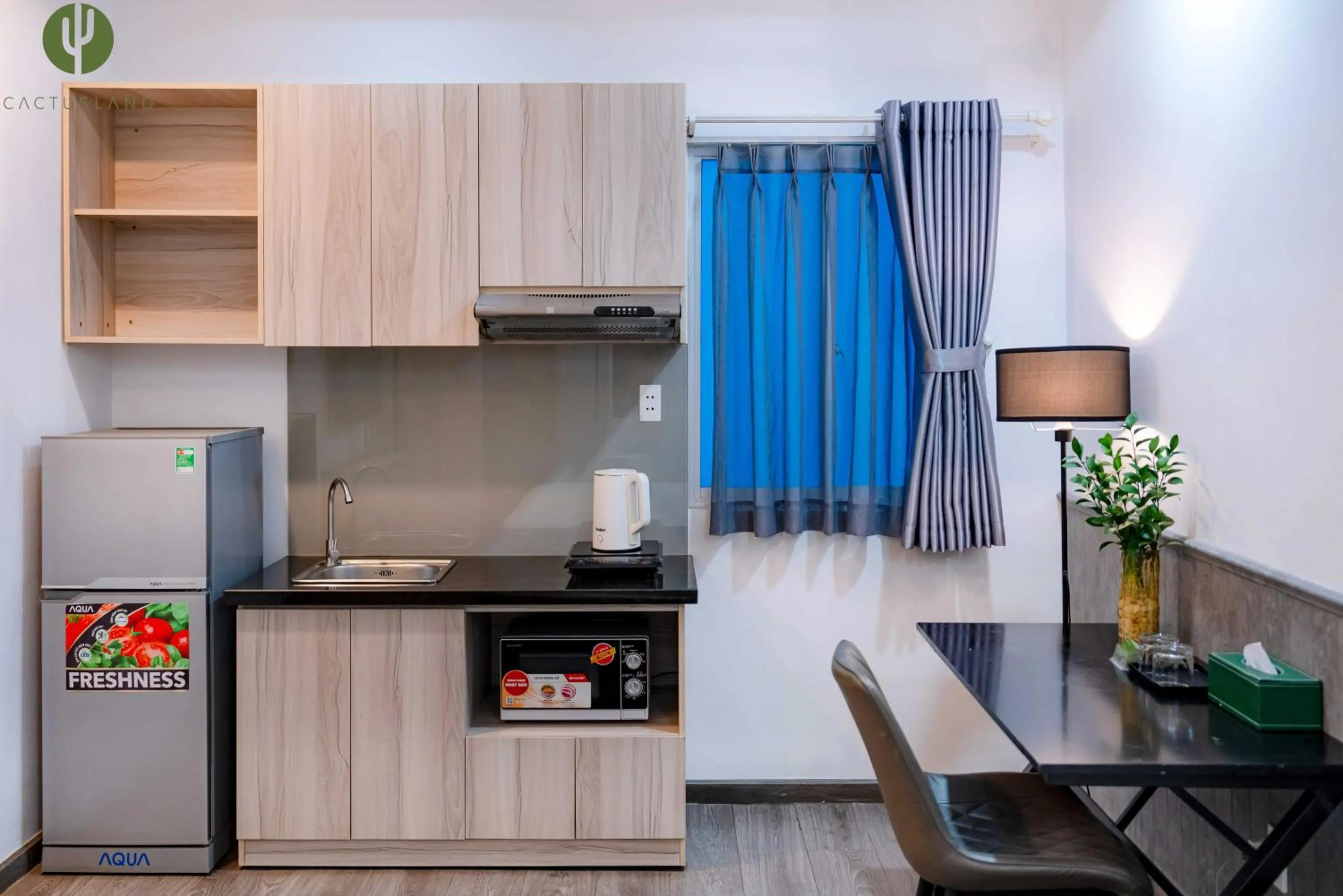 Kitchen or kitchenette in Cactusland Hotel & Apartment