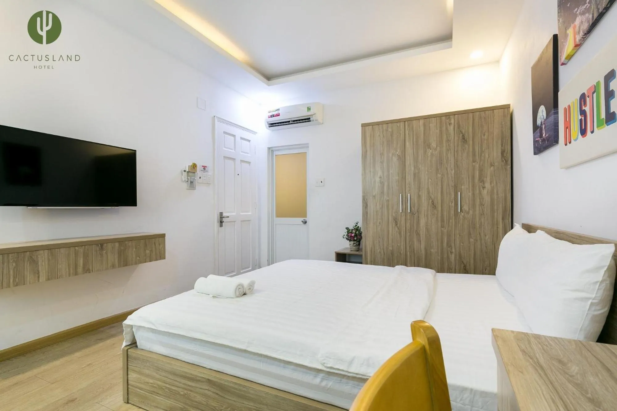 Bed in Cactusland Hotel & Apartment