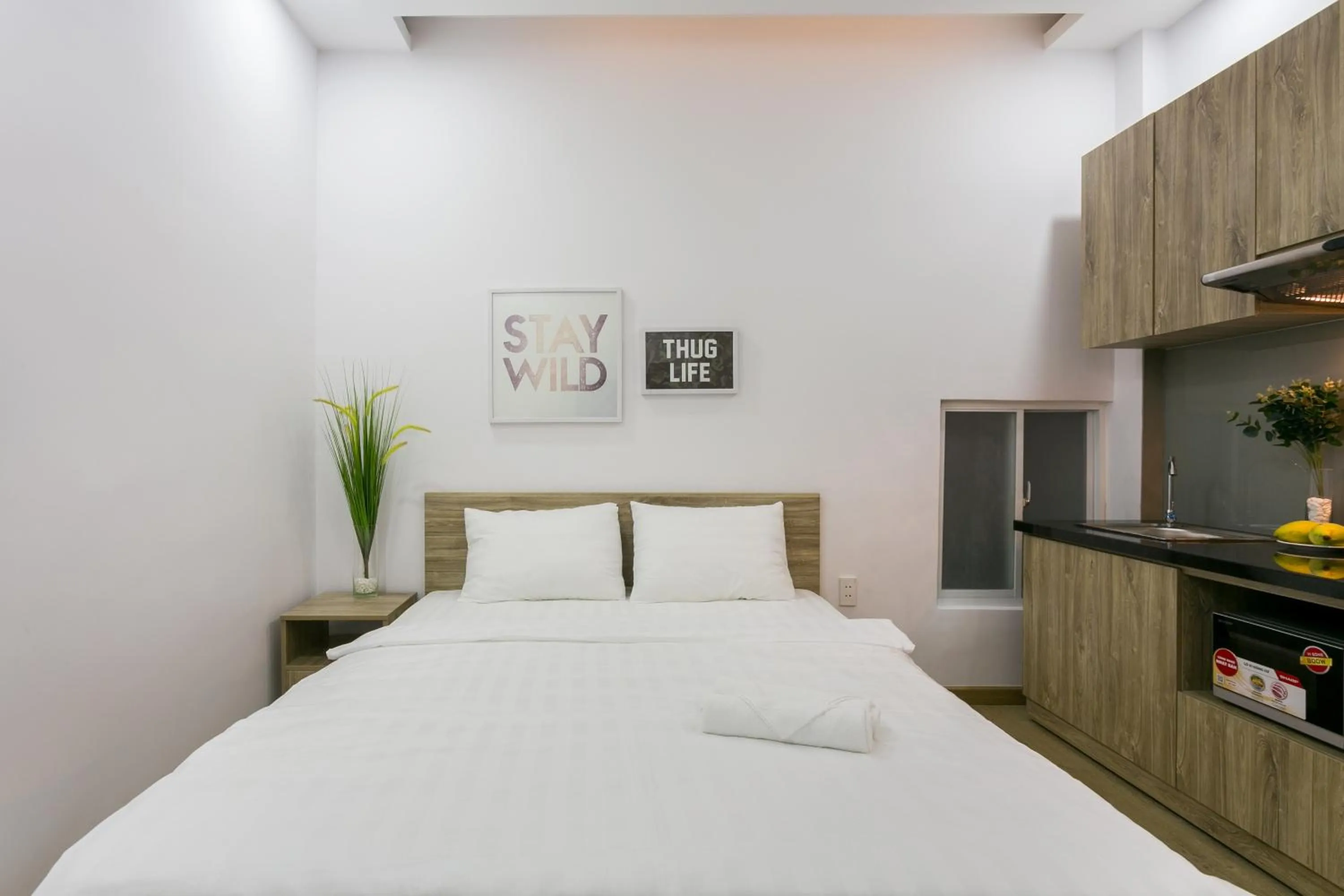 Bed in Cactusland Hotel & Apartment