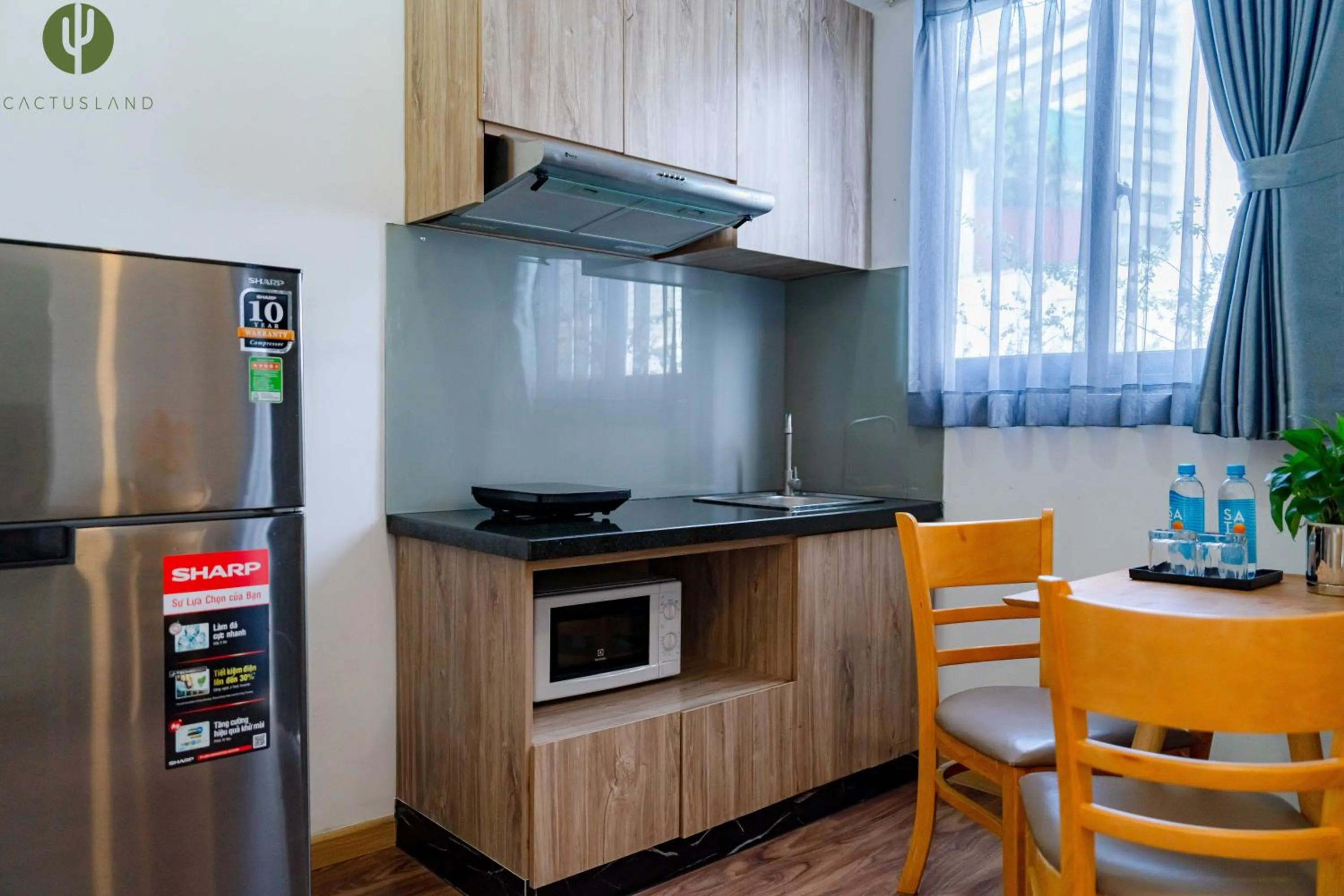 Kitchen or kitchenette in Cactusland Hotel & Apartment