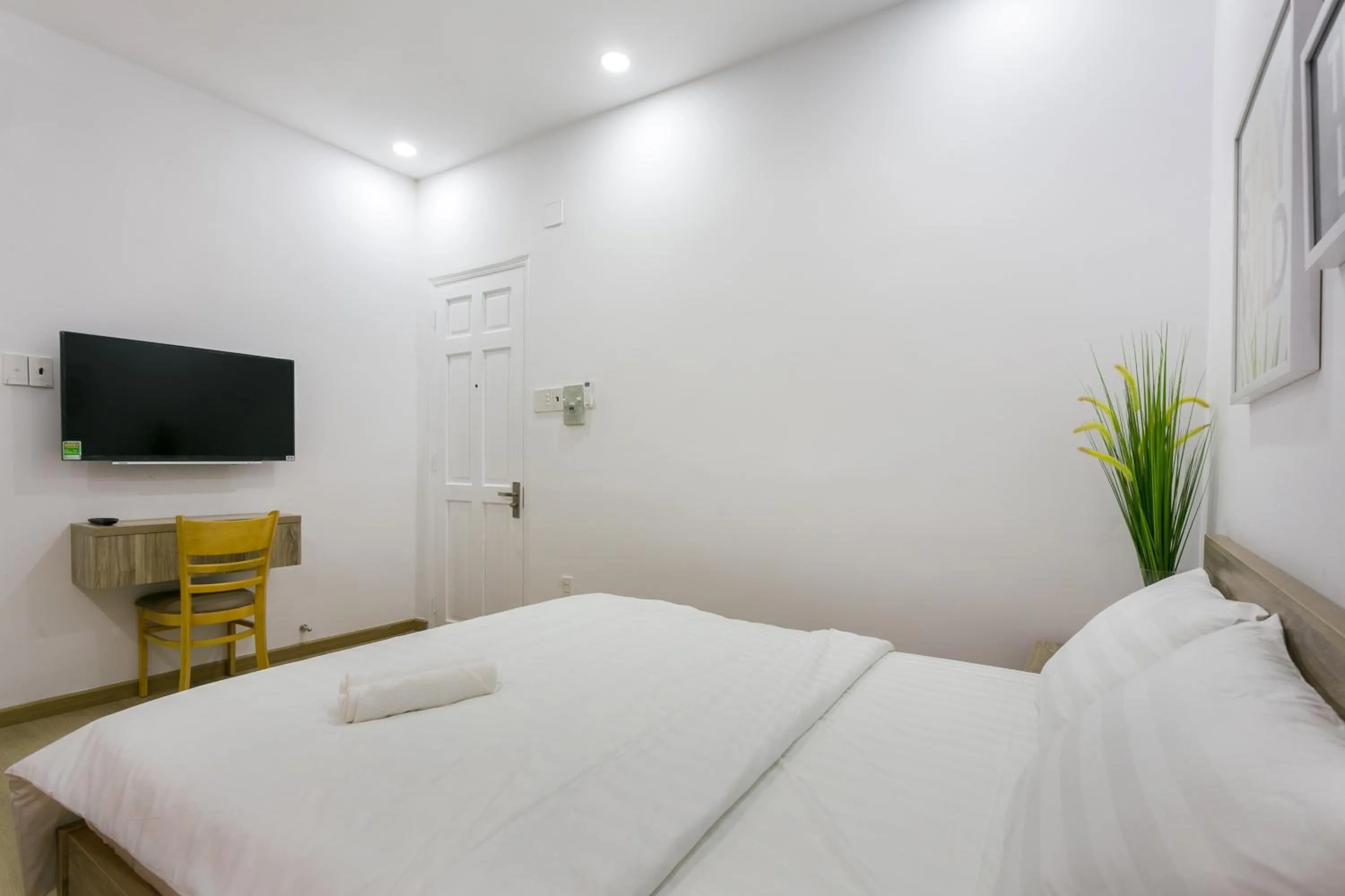 Bed in Cactusland Hotel & Apartment