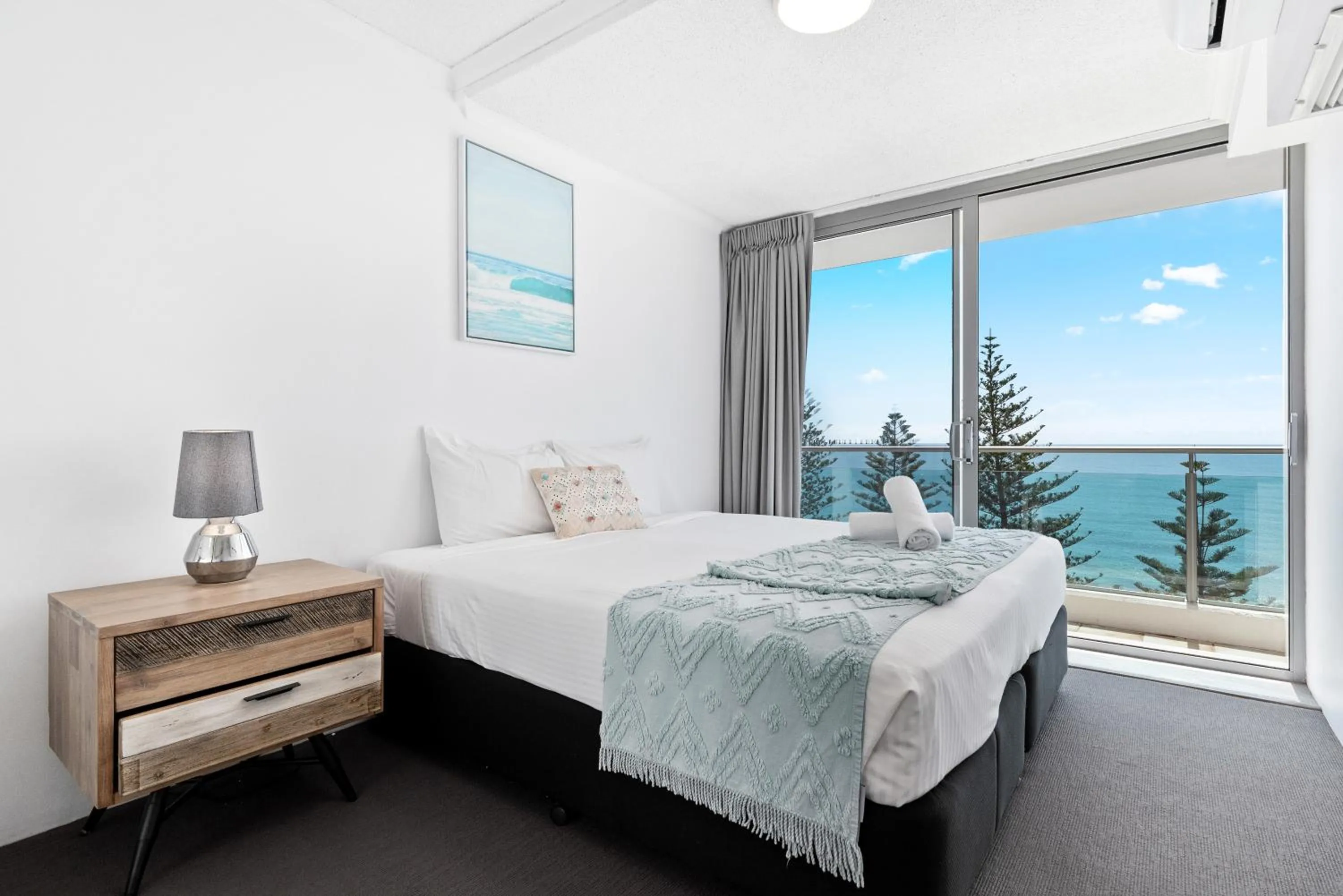 Bed in Northwind Beachfront Apartments