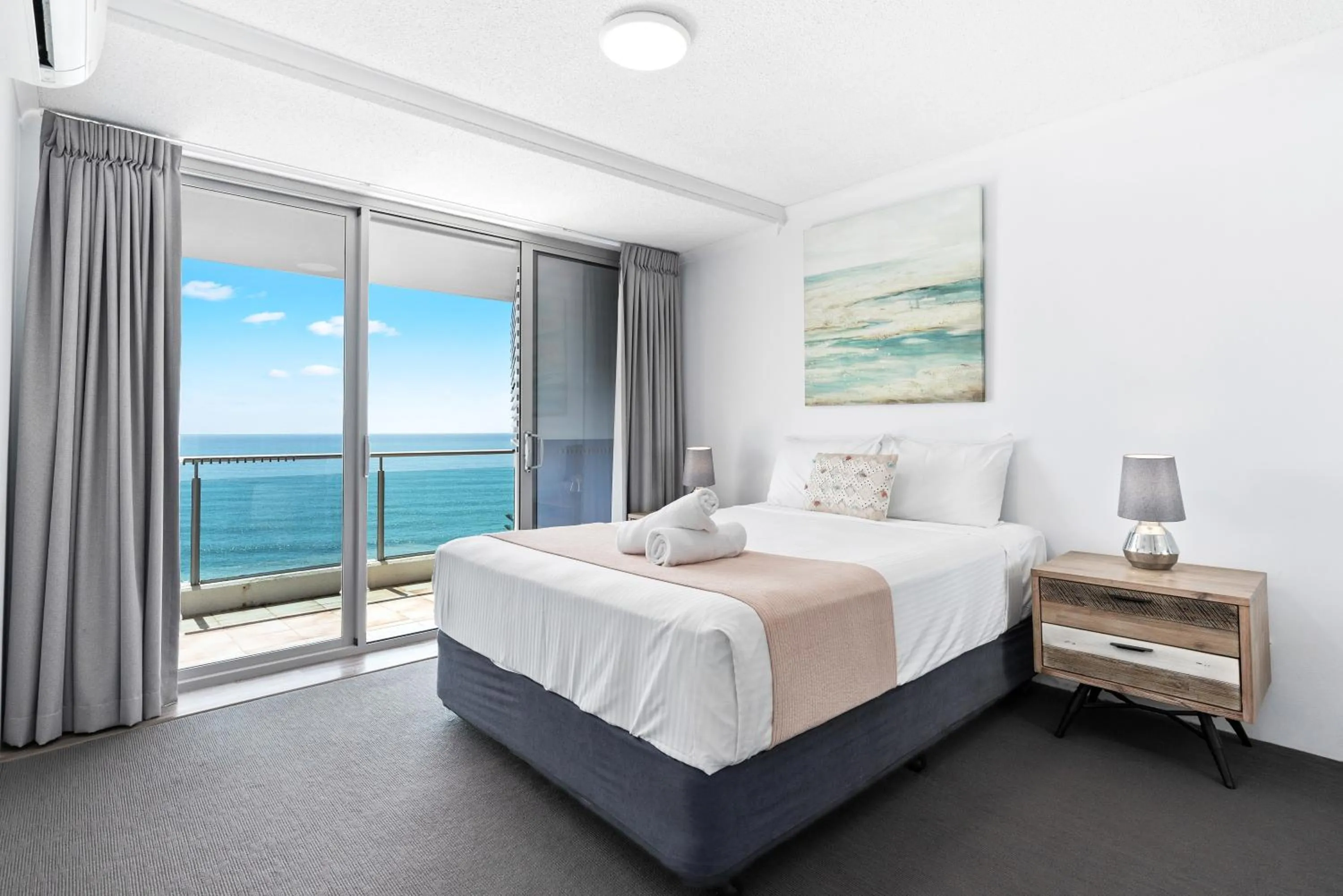 Bed in Northwind Beachfront Apartments
