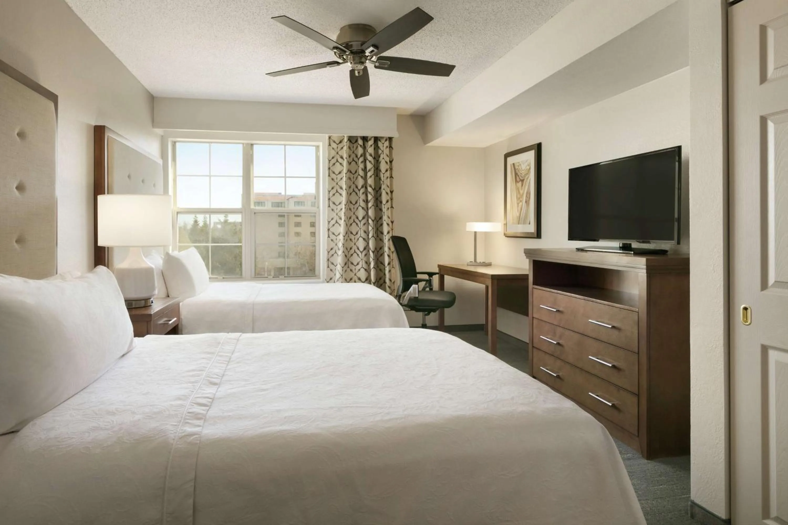 Bed in Homewood Suites by Hilton Kansas City Airport