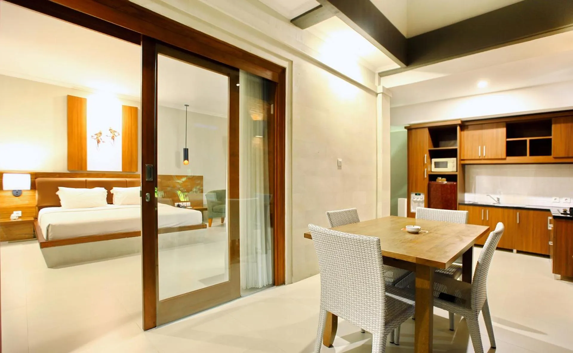 Kitchen or kitchenette, Bed in Mutiara Bali Boutique Resort & Villa