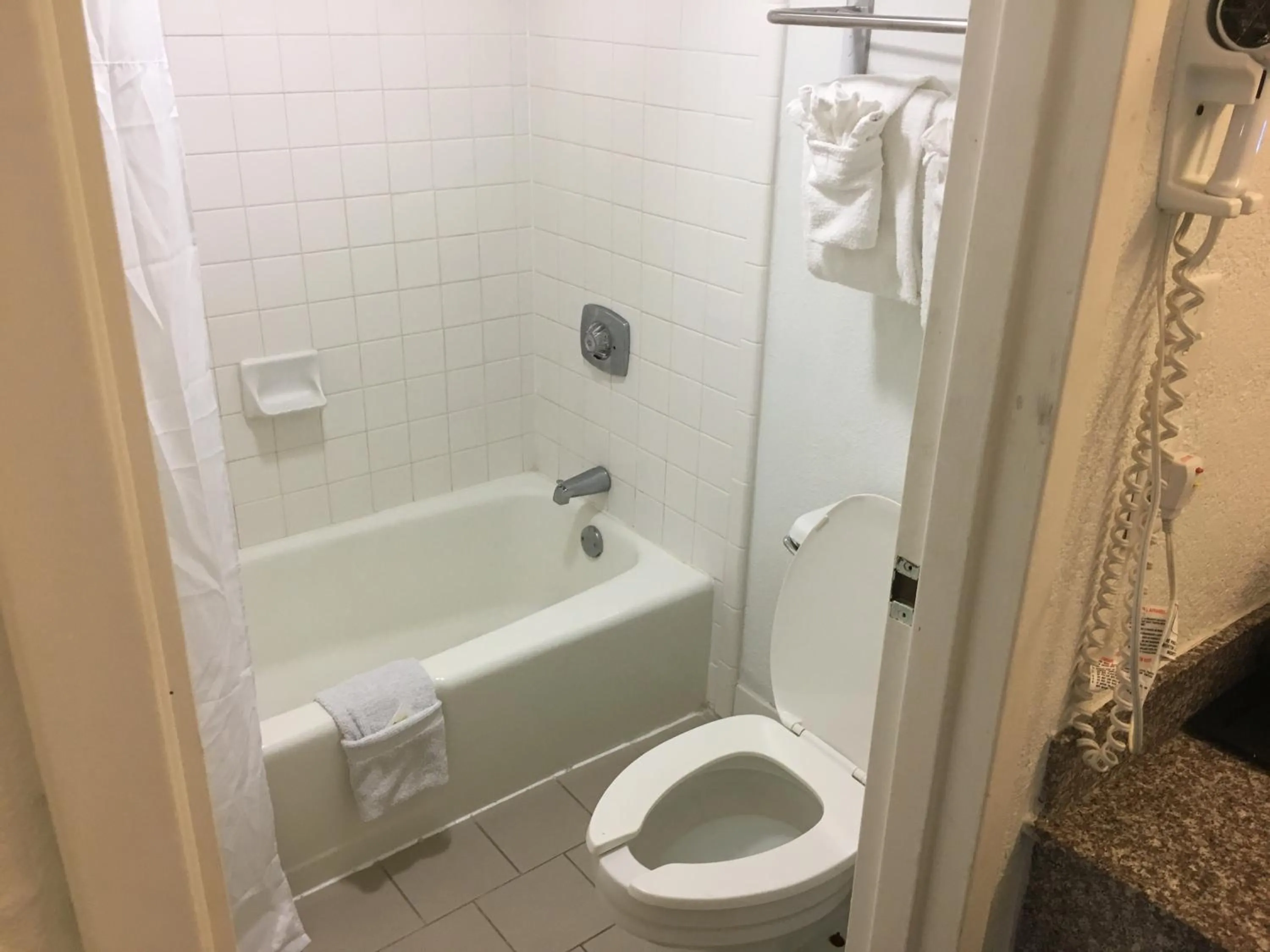 Toilet in Days Inn & Suites Mobile