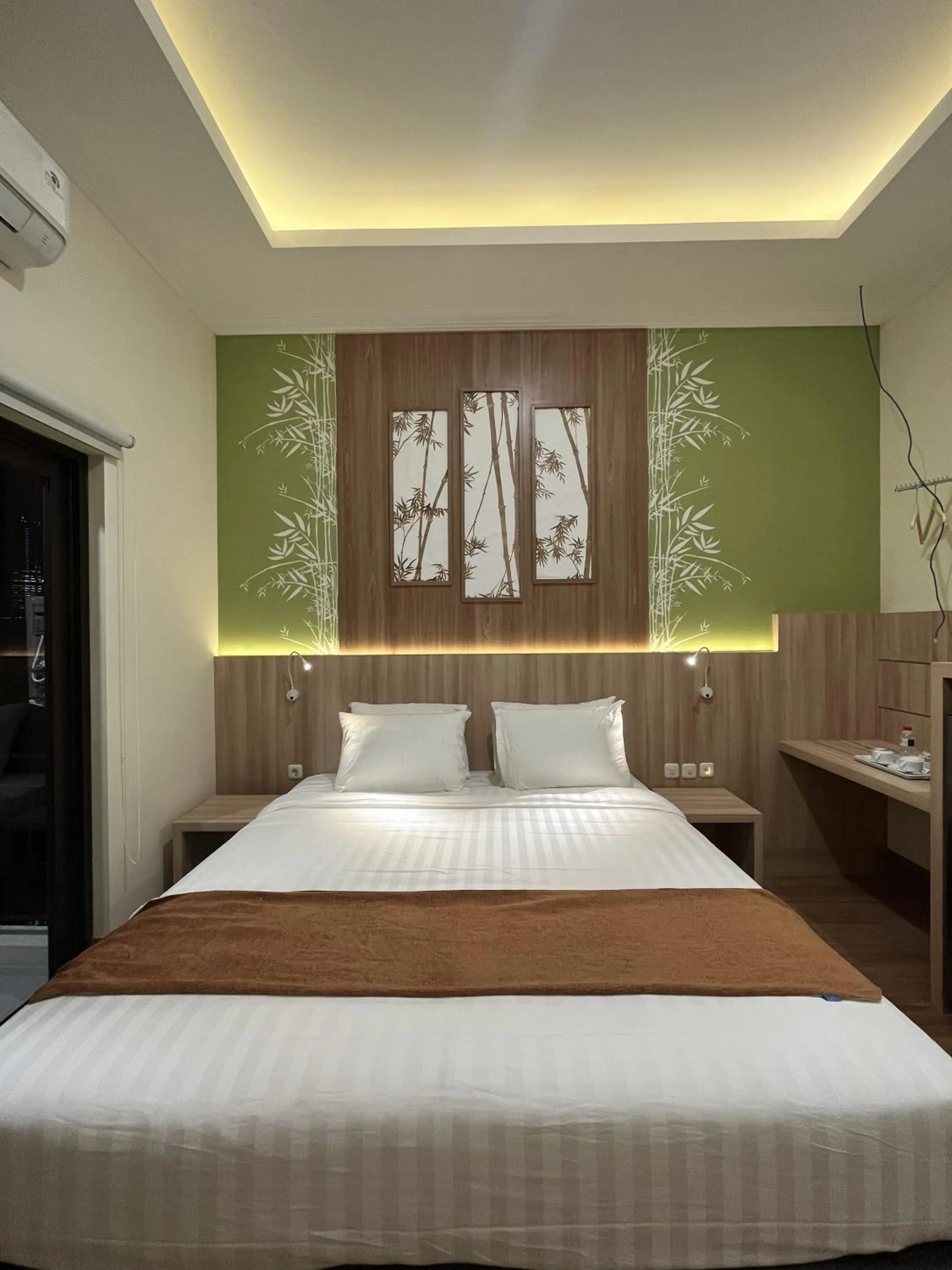 Photo of the whole room, Bed in D'Bamboo Suites