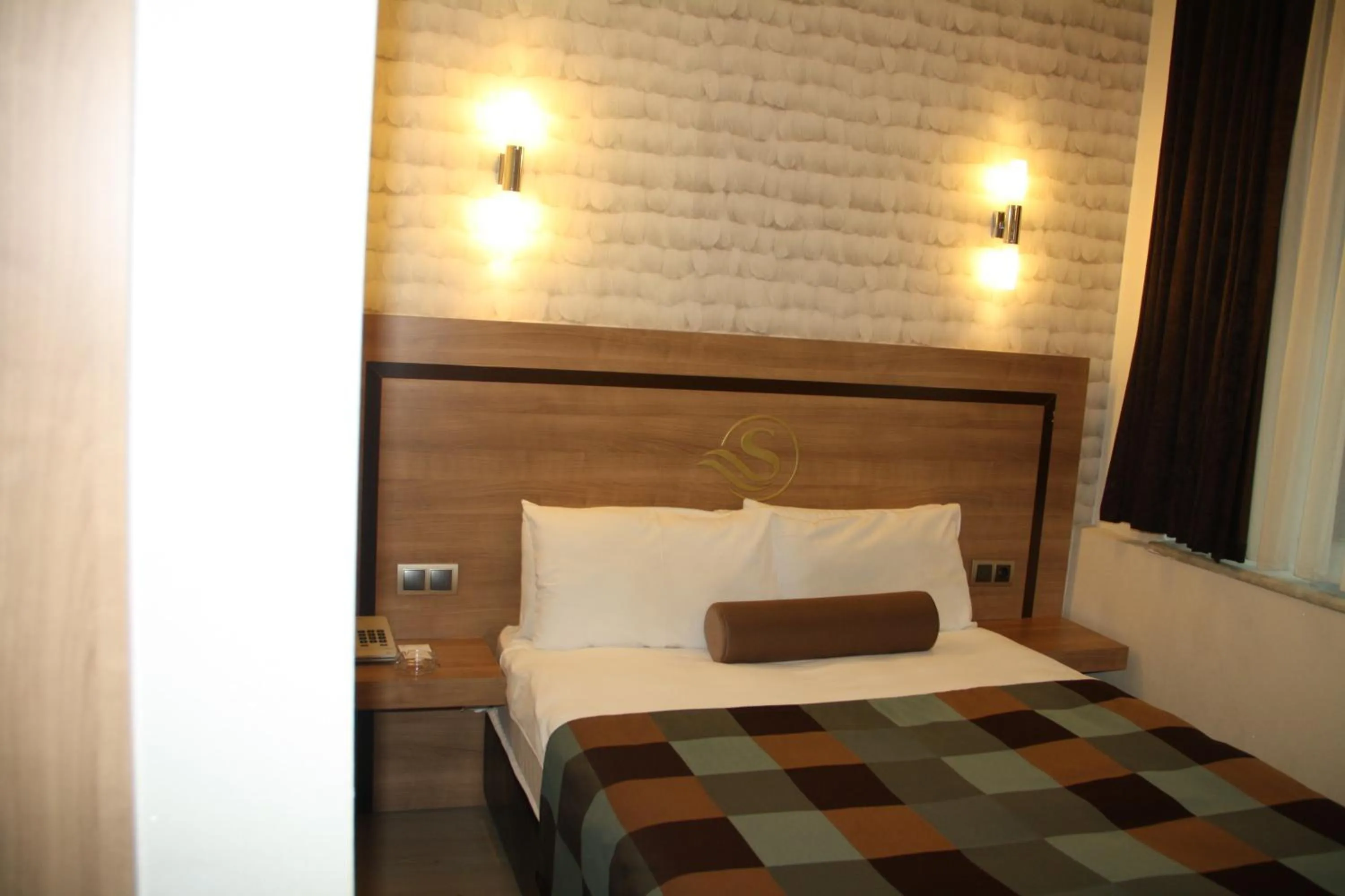 Bed in Susuzlu Seckin Hotel