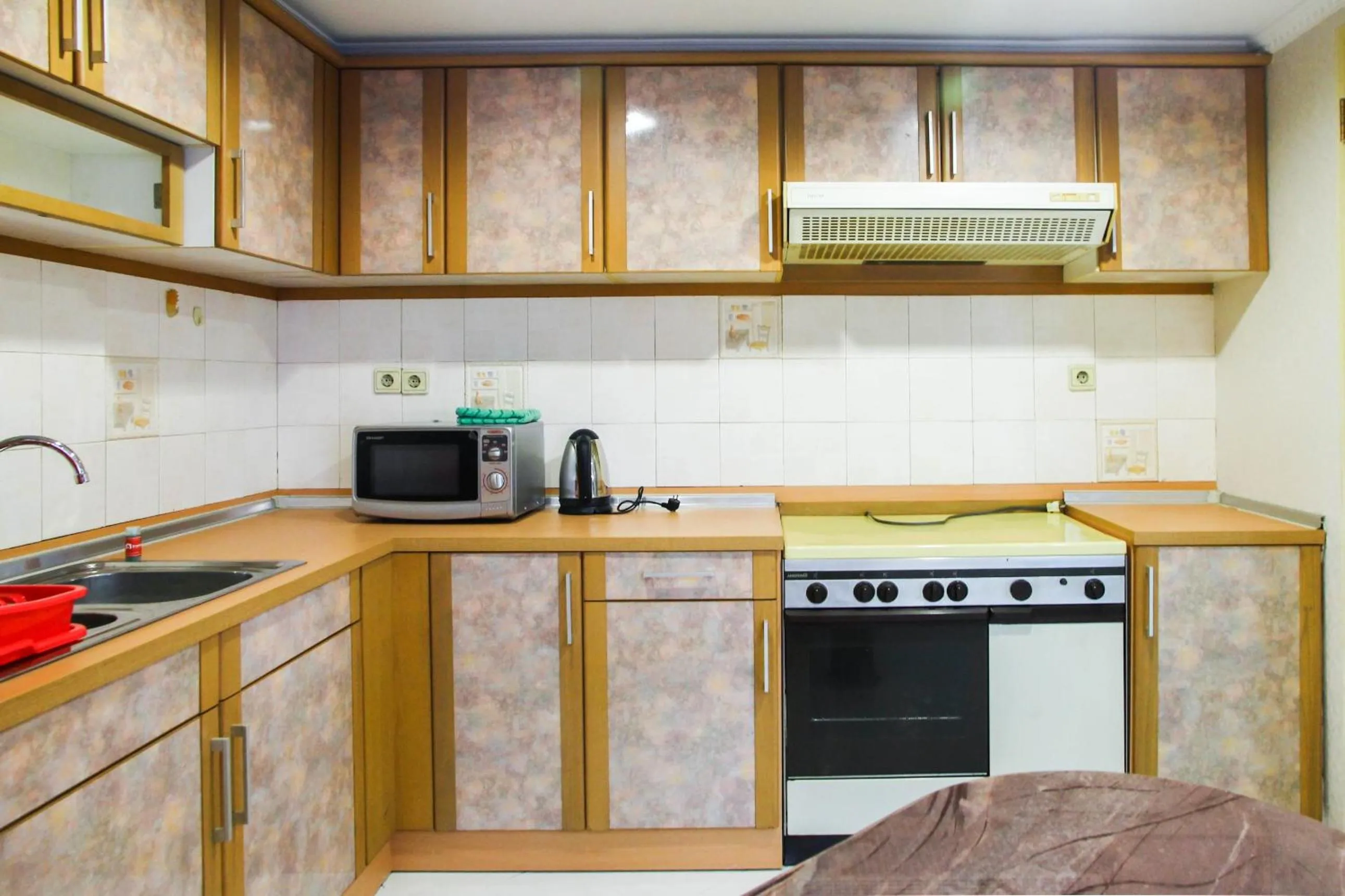 Kitchen or kitchenette in 2BR Family Sudirman Tower Condominium Apartment near Plaza Semanggi By Travelio