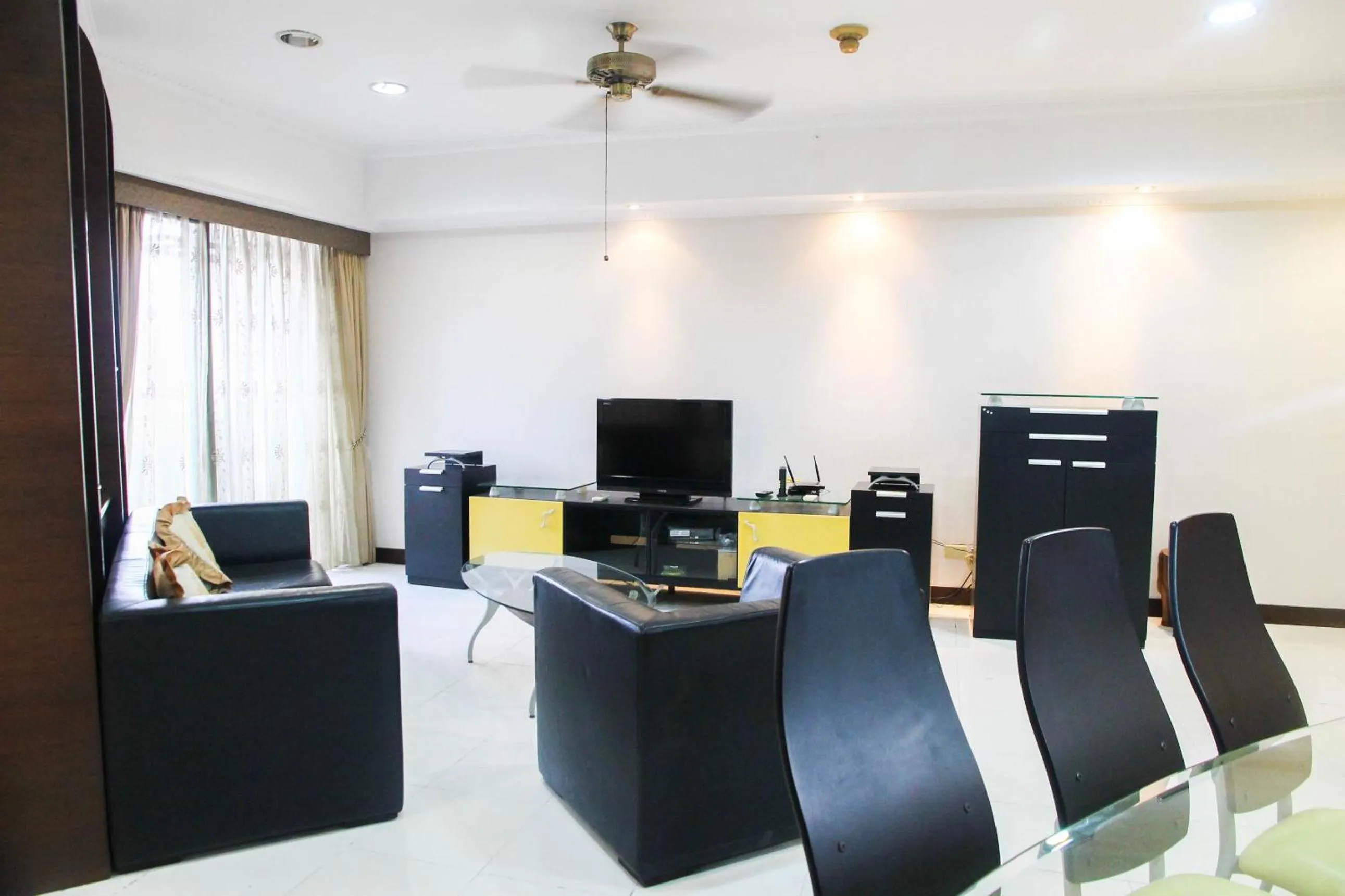 Living room in 2BR Family Sudirman Tower Condominium Apartment near Plaza Semanggi By Travelio