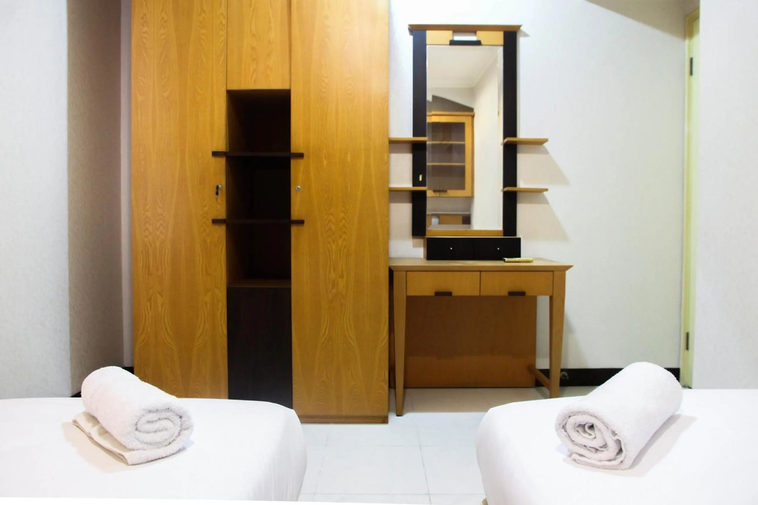 Bed in 2BR Family Sudirman Tower Condominium Apartment near Plaza Semanggi By Travelio