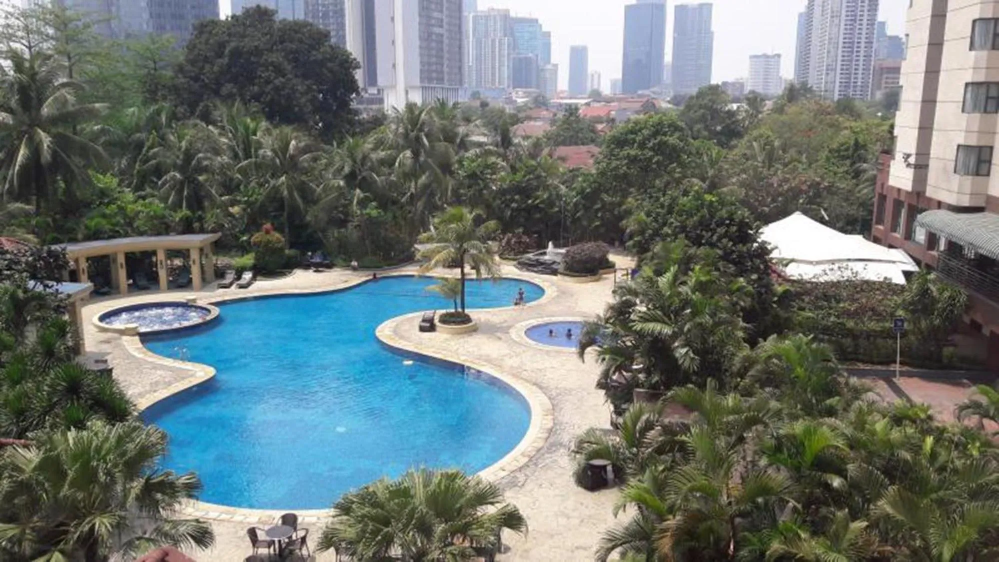 Swimming pool in 2BR Family Sudirman Tower Condominium Apartment near Plaza Semanggi By Travelio
