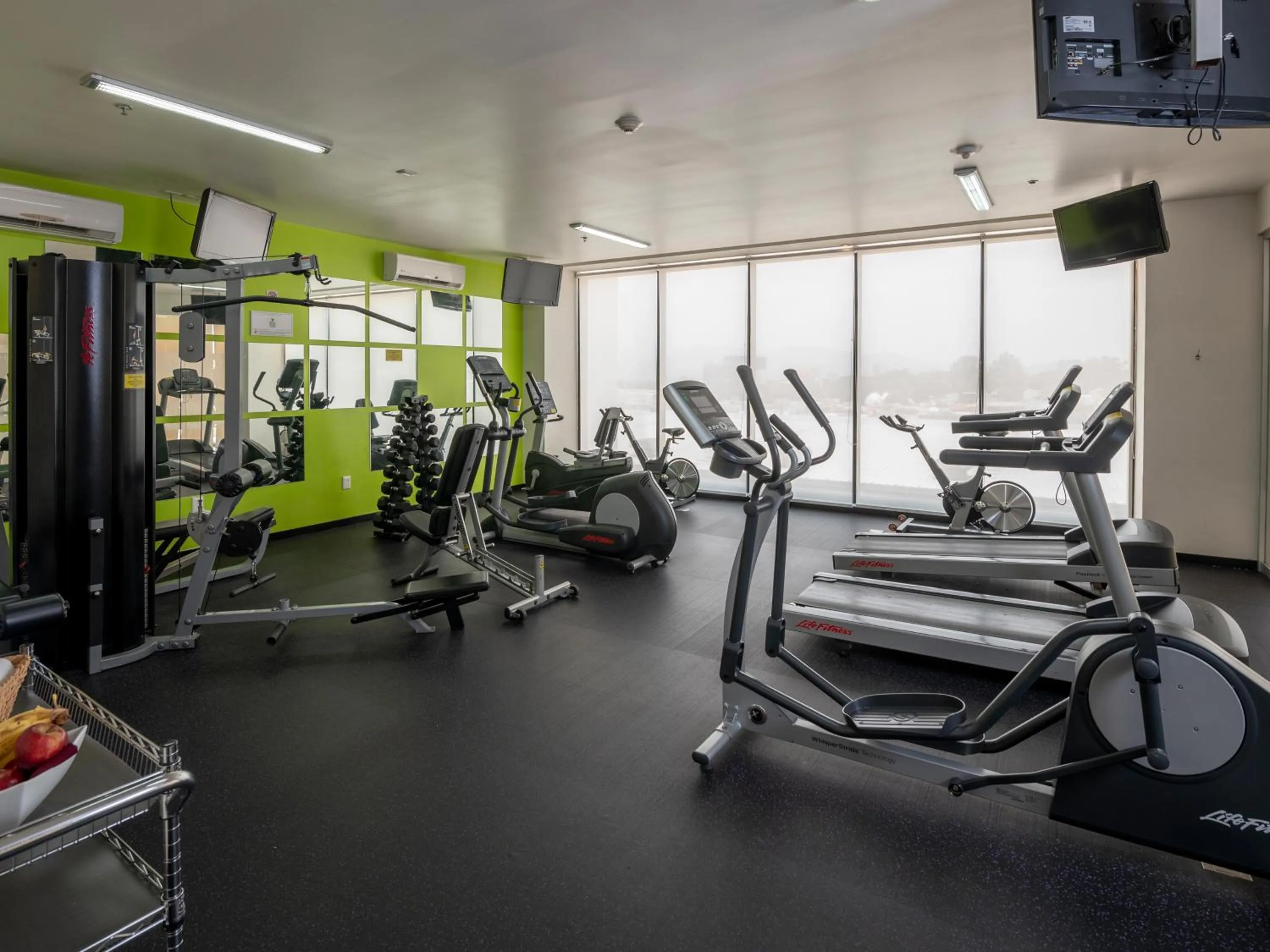 Fitness centre/facilities in Ramada Encore by Wyndham Guadalajara Sur