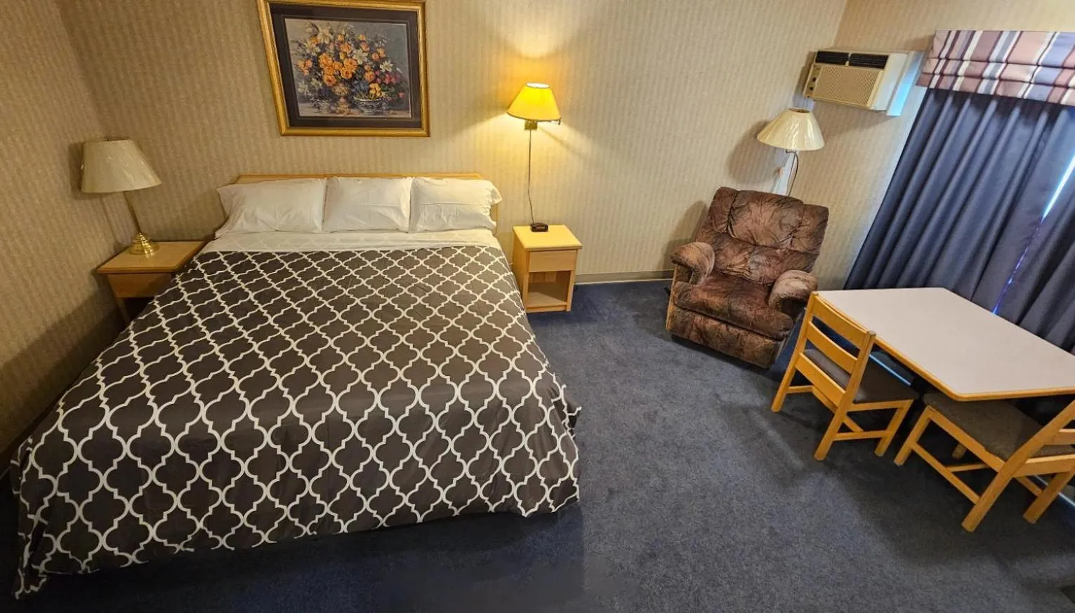 Bed in Perfect Inns & Suites